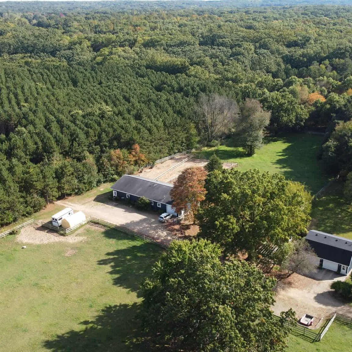 A view of the horse barn and pastures in 2025