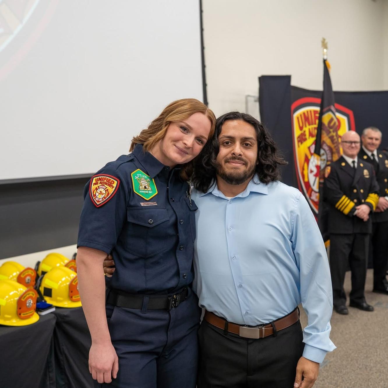 Damon pinned my badge on at my Firefighter graduation.