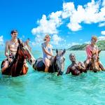 Ride a horse on Cas En Bas beach