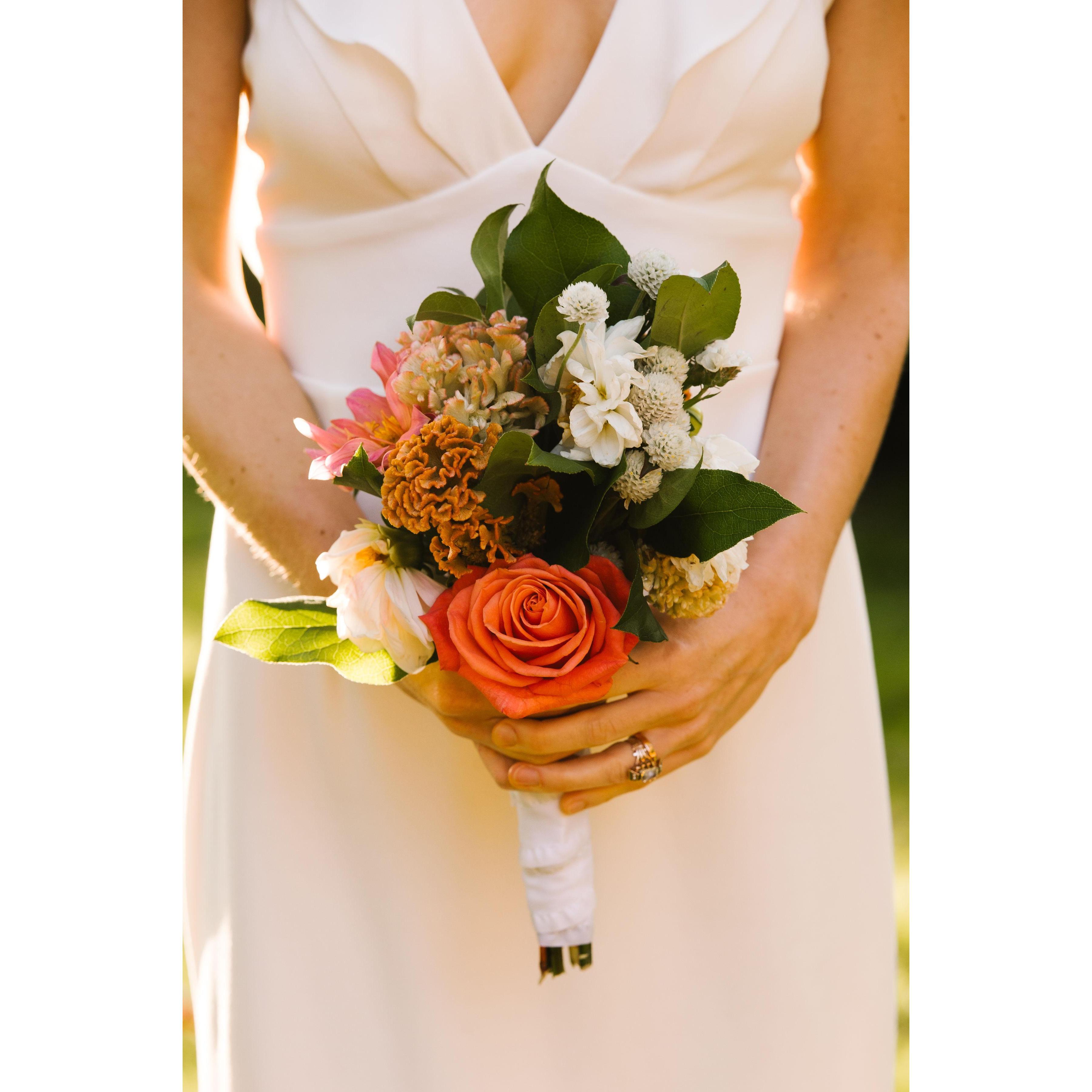 The day before the ceremony, we visited the farm up the street from our home and cut our own flowers. We created our own table arrangements, bouquet, and boutonniere for our big day.
