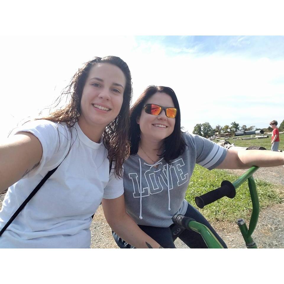 Riding bikes. Cara won the tricycle race, despite Tina's claims that her bike was insufficient.
