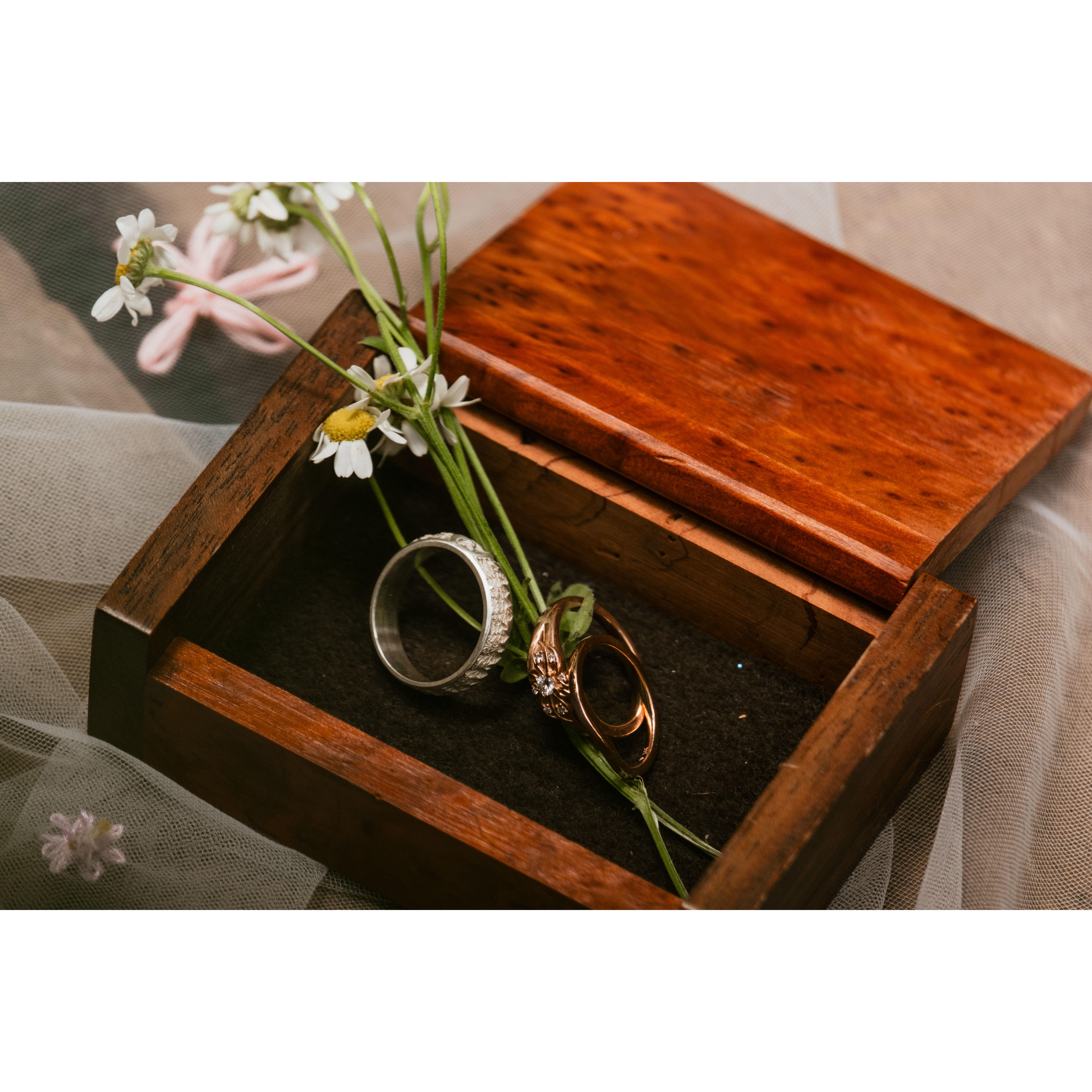 Rings in a box made from wood from the Yager's property