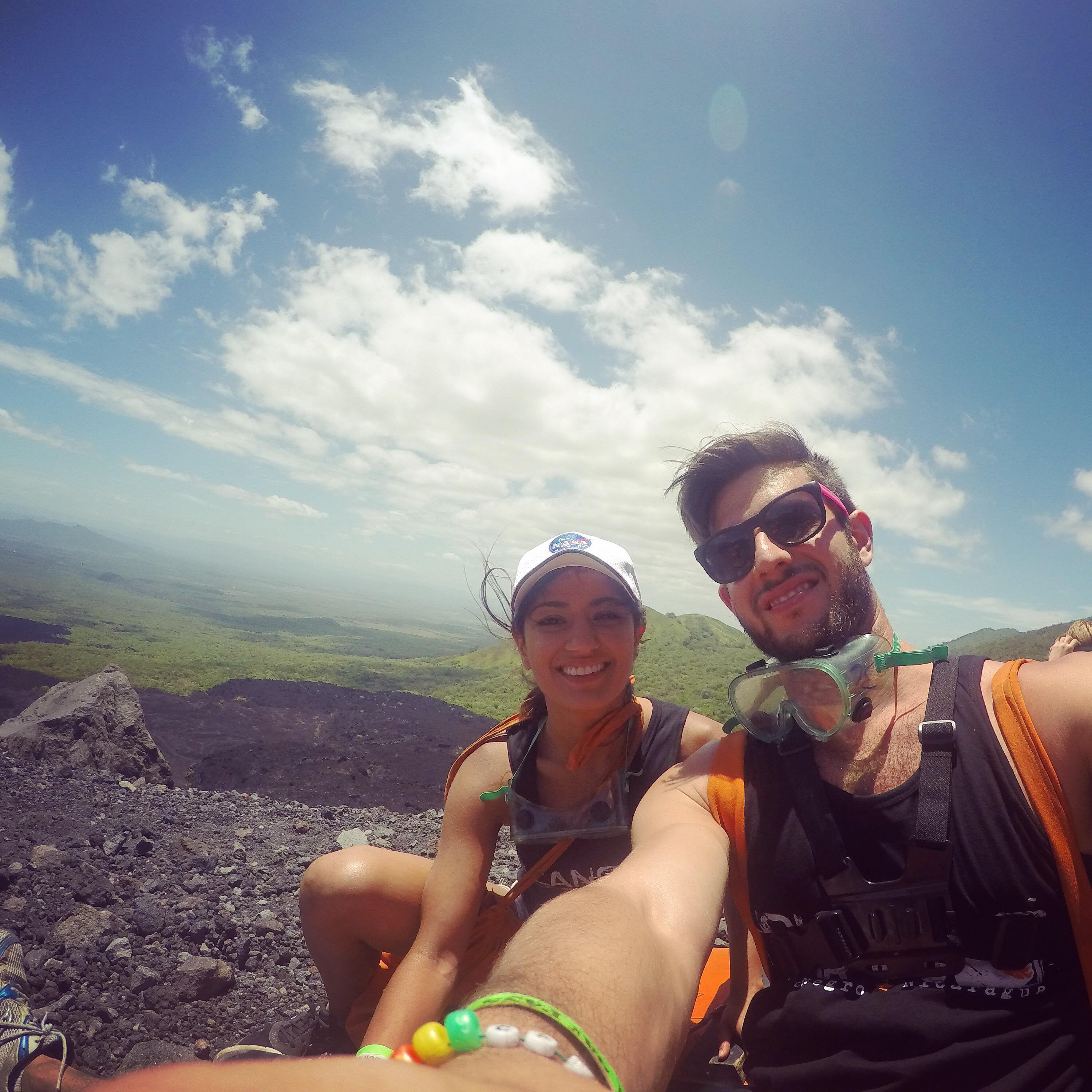 Our very first vacation together in Nicaragua. This particular photo is at the top of an ash volcano and the lab goggle gear is about to be used for volcano boarding!