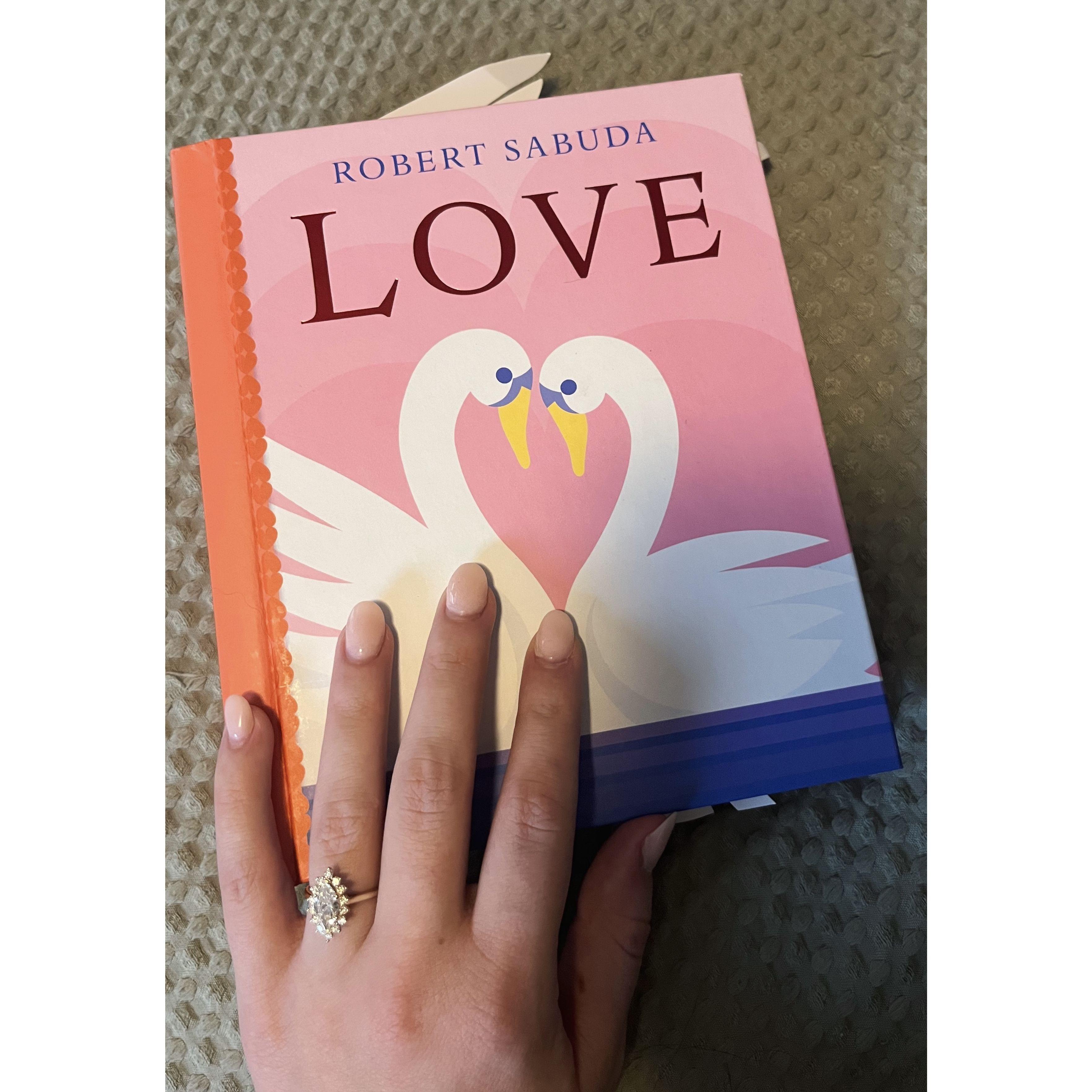 This was the day after our engagement. We went shopping and we found this book. Dylan bought it because we felt it expressed our love for each other, and this moment in our lives, perfectly!
