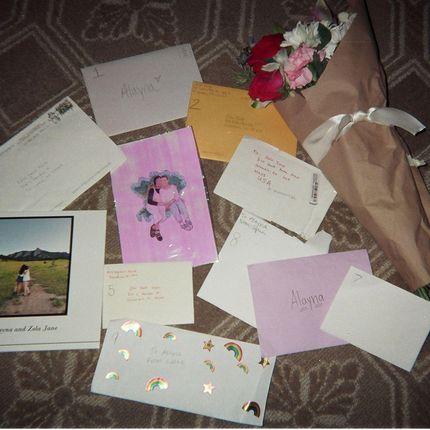 A collection of notes, photos, and flowers from ZJ to Alayna
