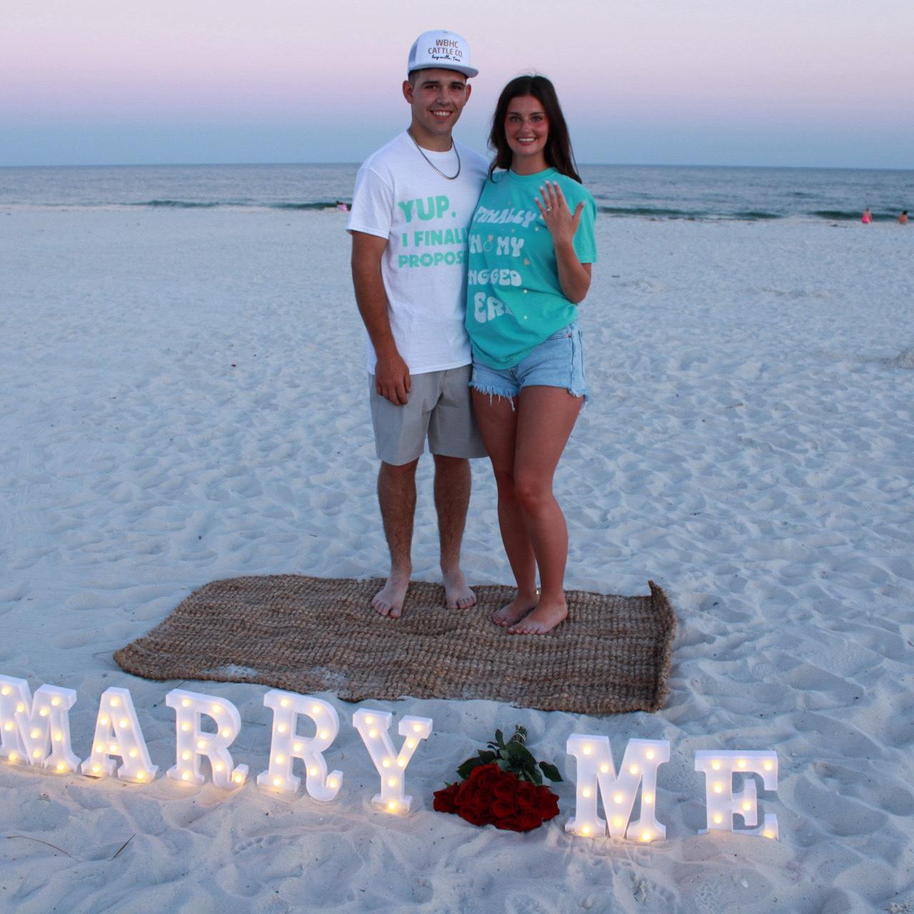 Engaged on the beach