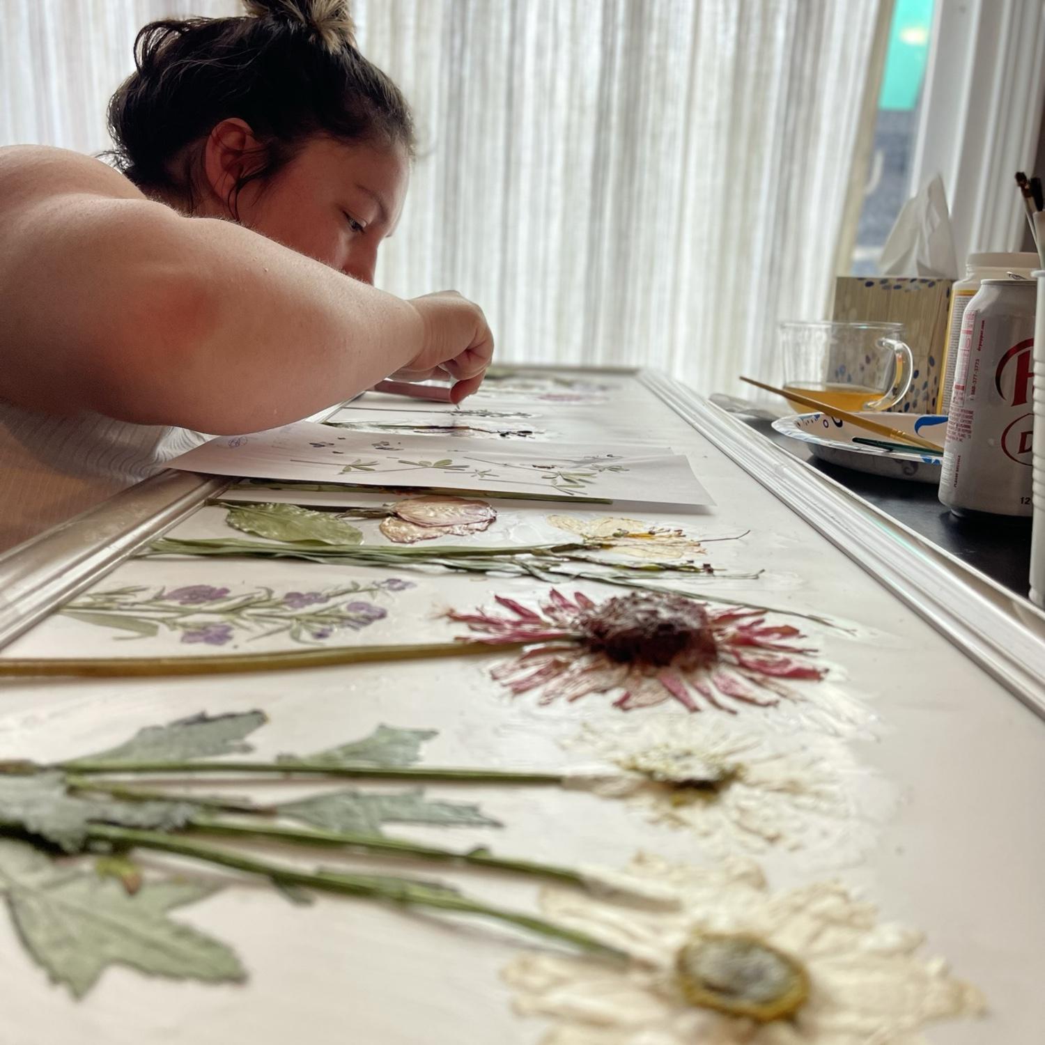 Carissa made me this beautiful piece of art out of the flowers she saved from the bouquets we were giving each other. - Kelly