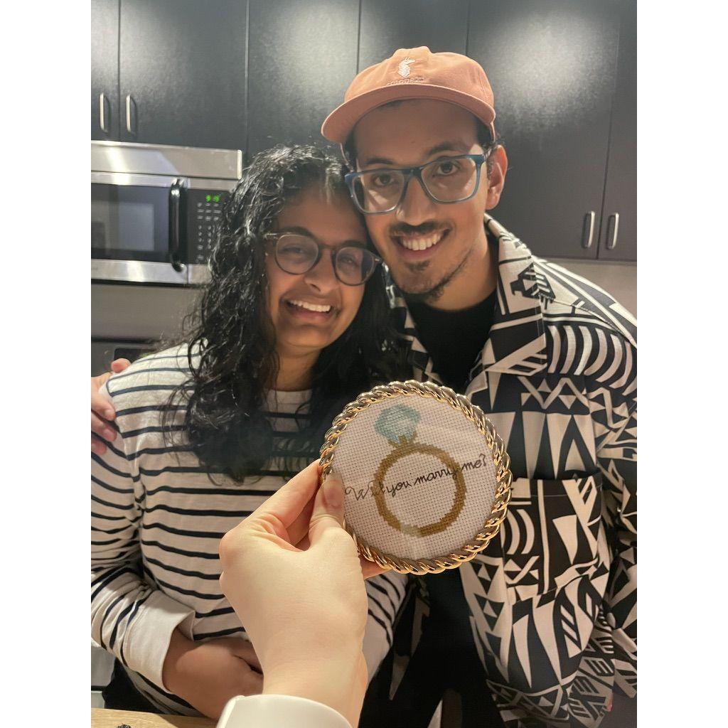 Pooja proposed in Japan with a cross stitched ring.