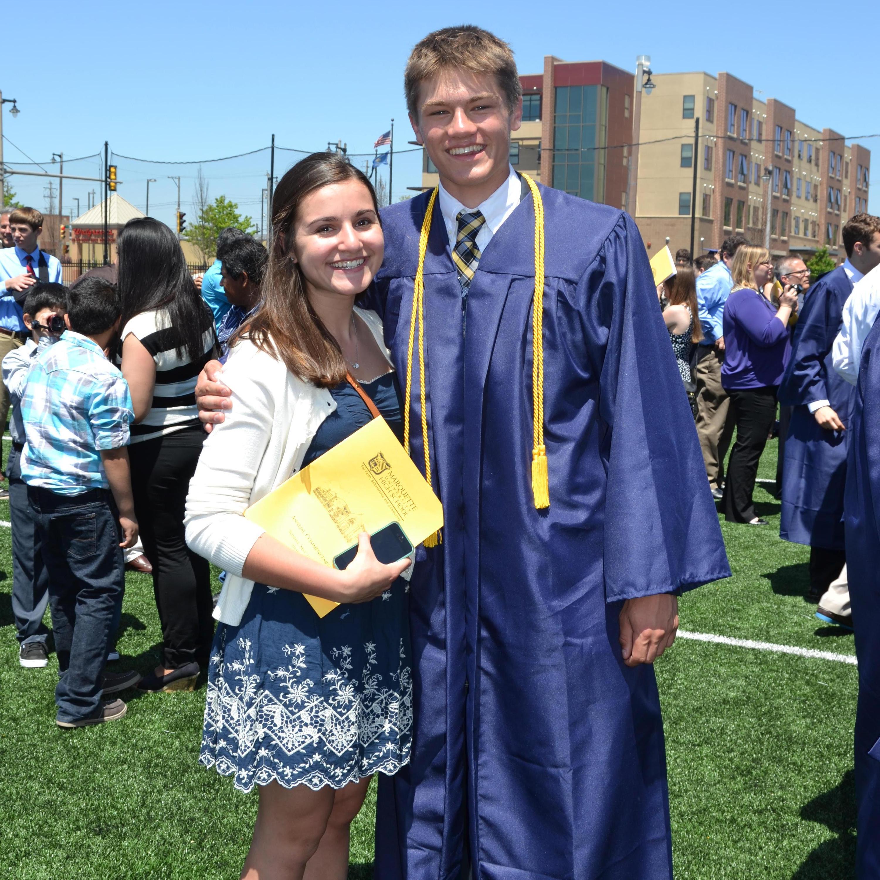 Our first picture together -- before we were dating! -- at Alex's high school graduation in 2014.