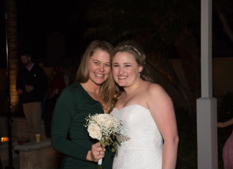 Renee catches the bouquet at their first wedding together!