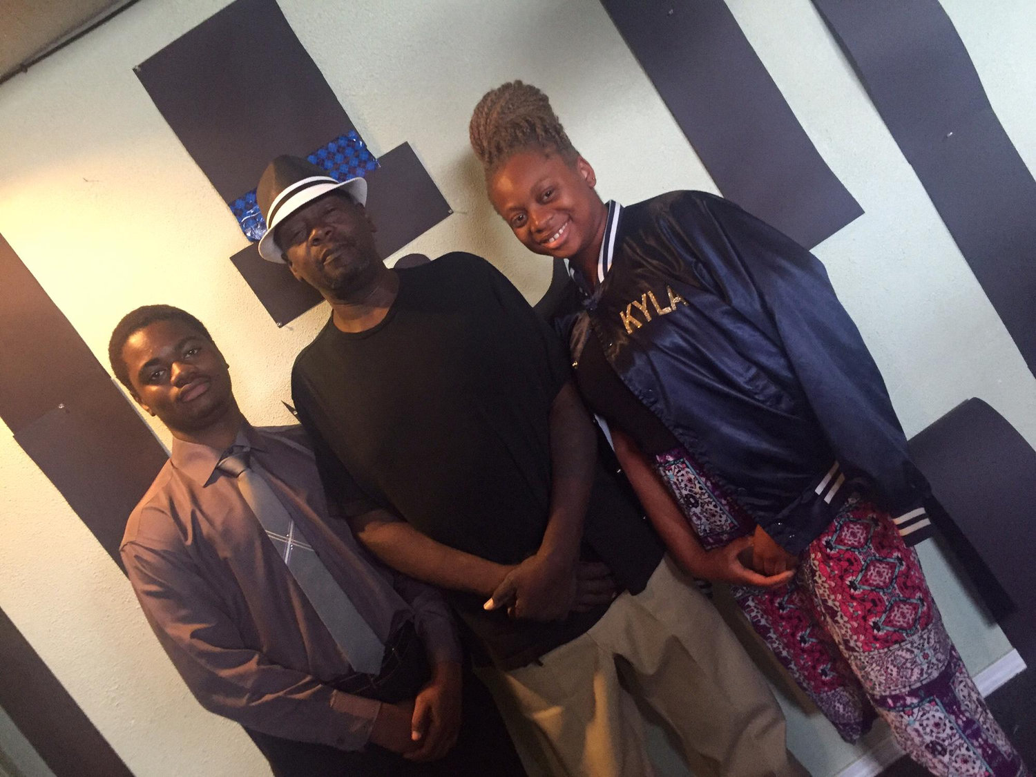 Kyla, Lester, and their granddad “Ded” (Sylvester) at church