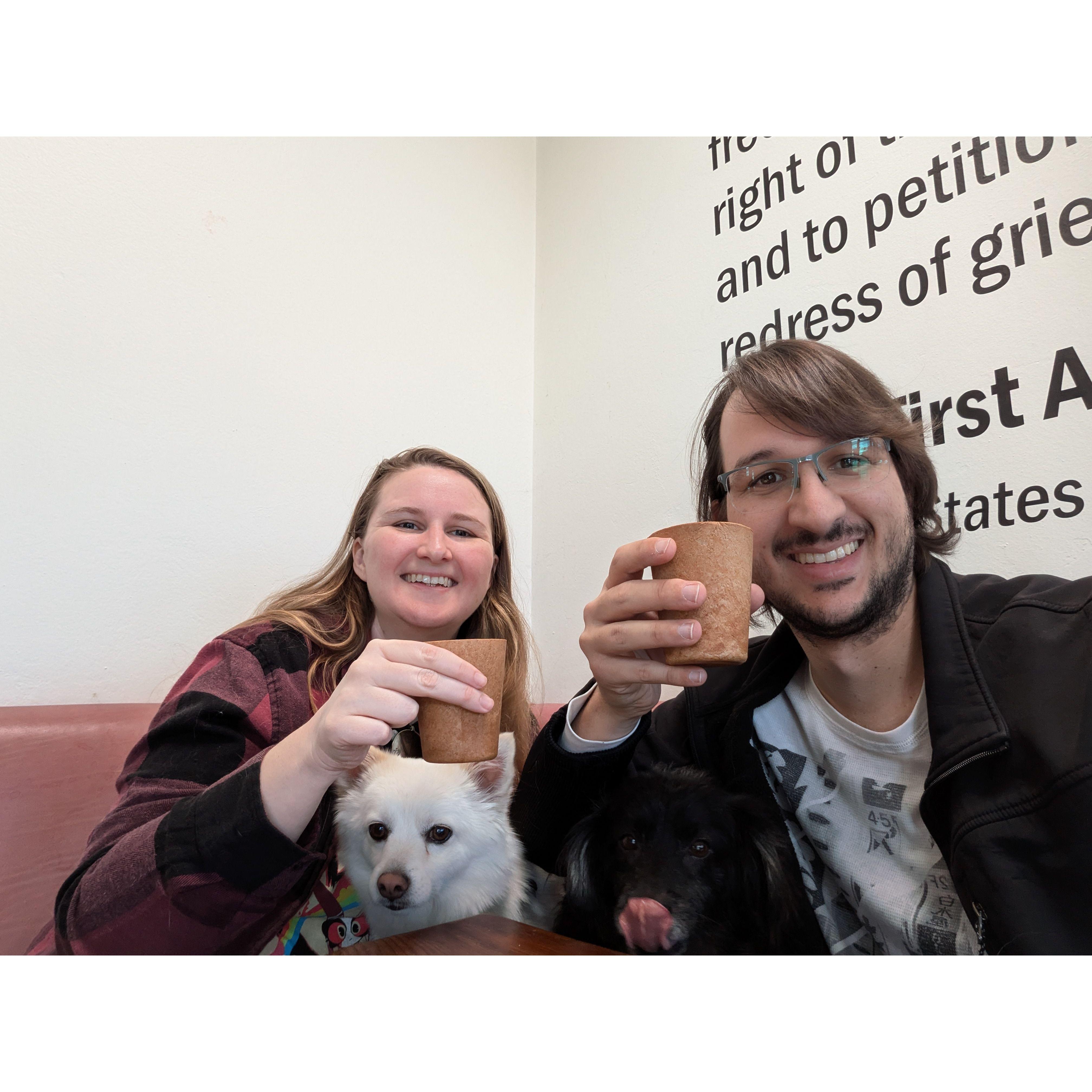 Enjoying a drink and a bite in a cafe in Monterey with familiars Arthur and Robin.