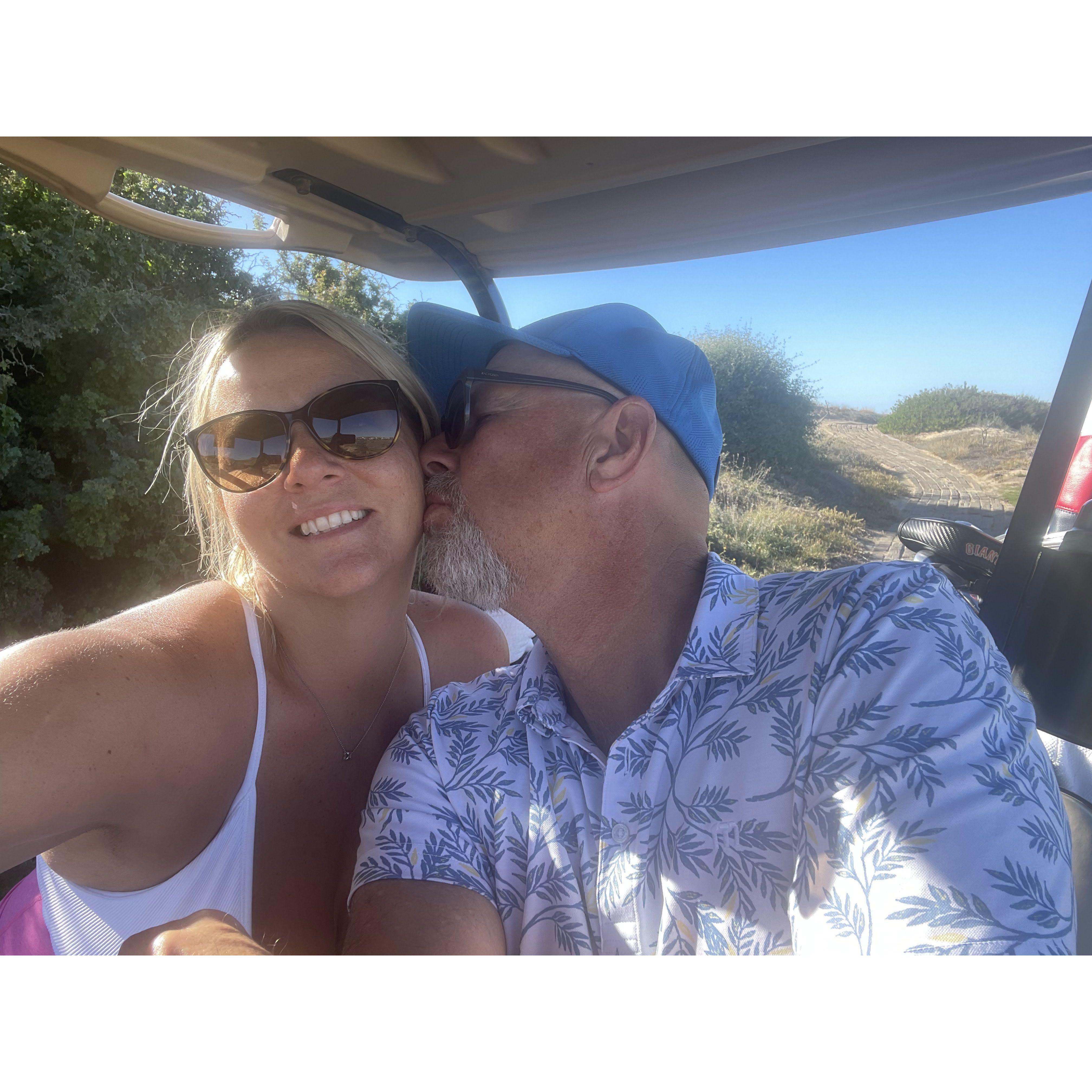 On the green, Megaan supports Bob and his love of golf!