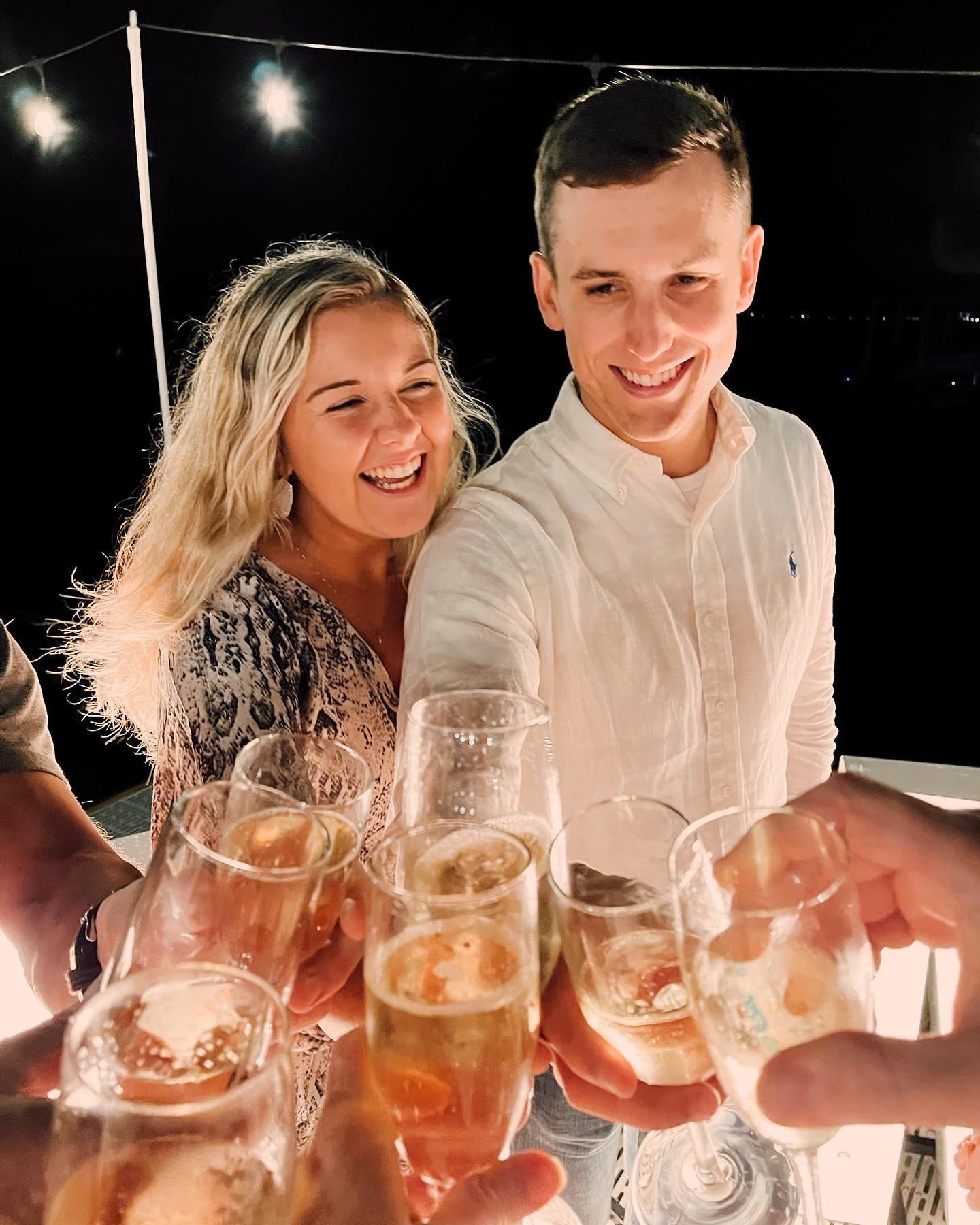 Cheers-ing to a lifetime together.