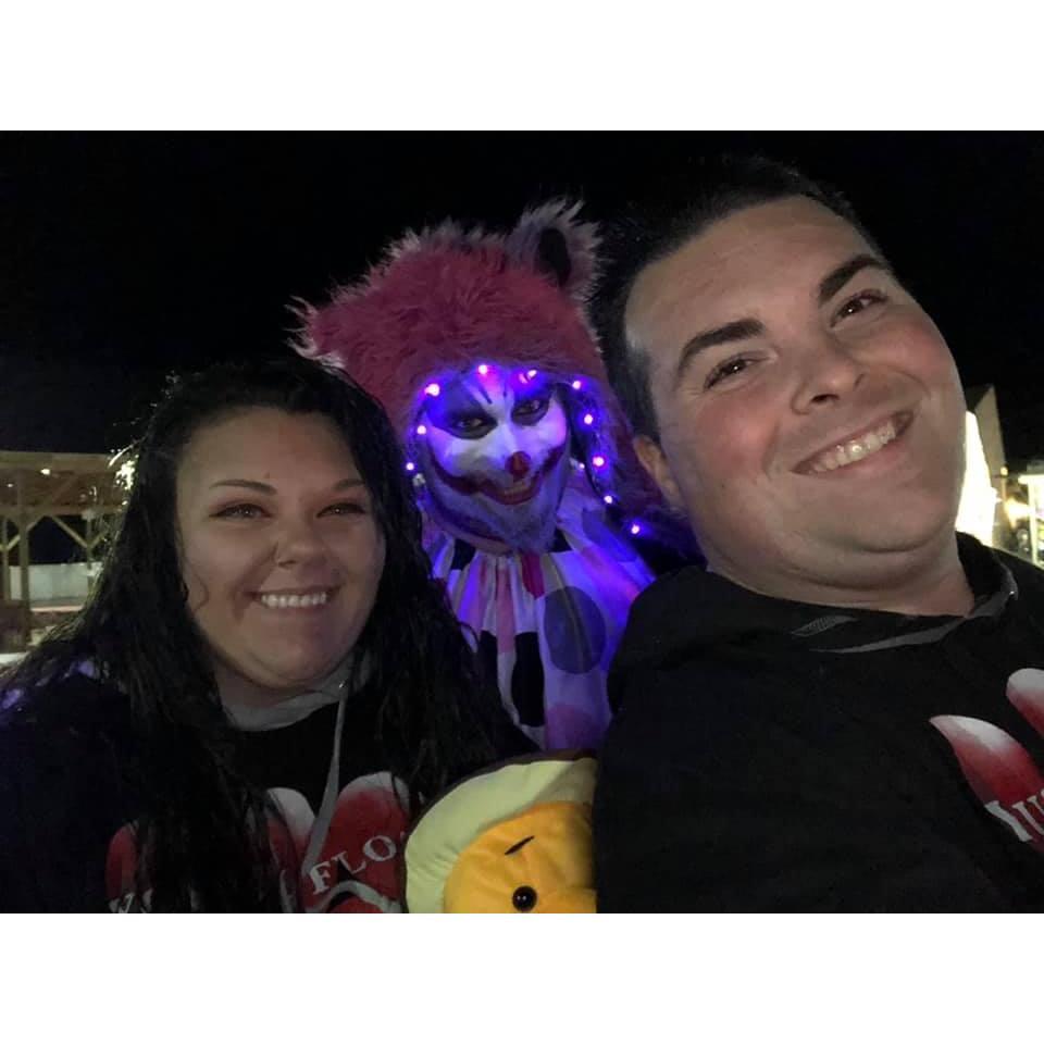 He won me that pooh bear then we took a picture with the cool cat