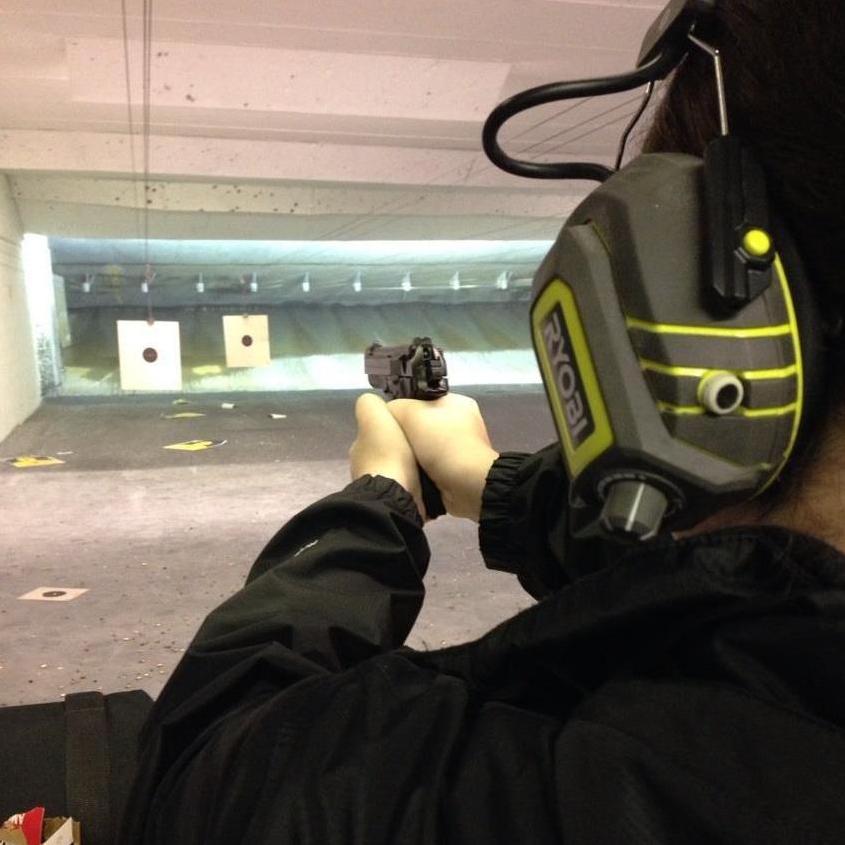 Chris & his dad taught Janel how to shoot - she didn't love it... lol!