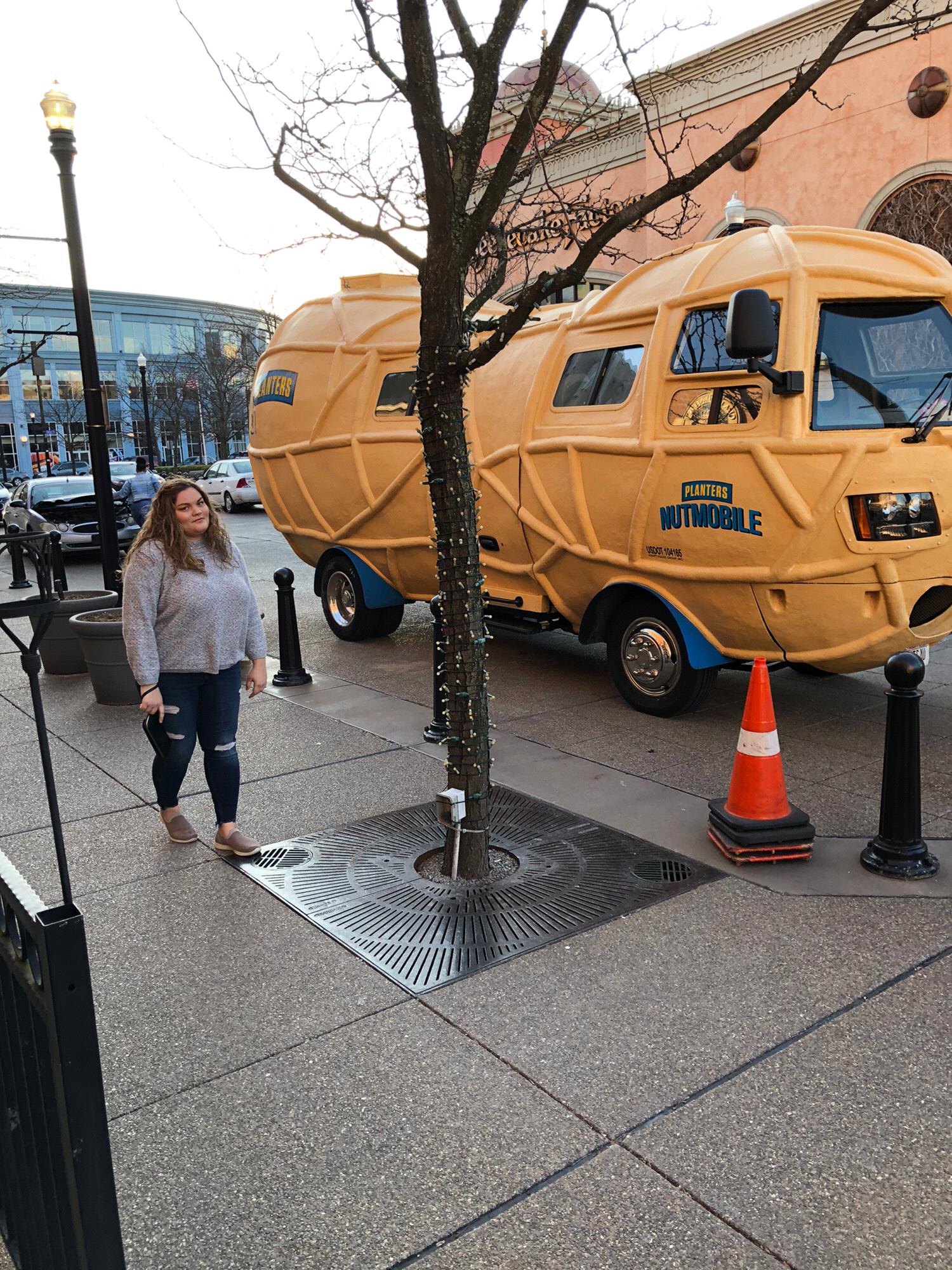 I made us both take a picture with the Nut-Mobile. She was not as thrilled as I was.