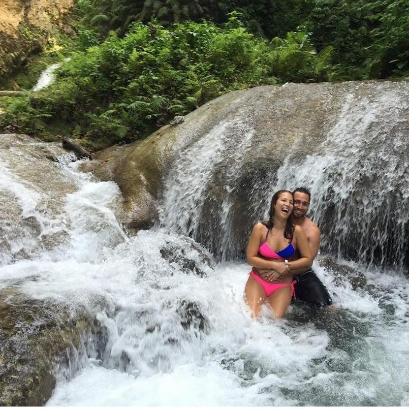 Swimming across waterfalls in Ochos Rios, Jamaica.