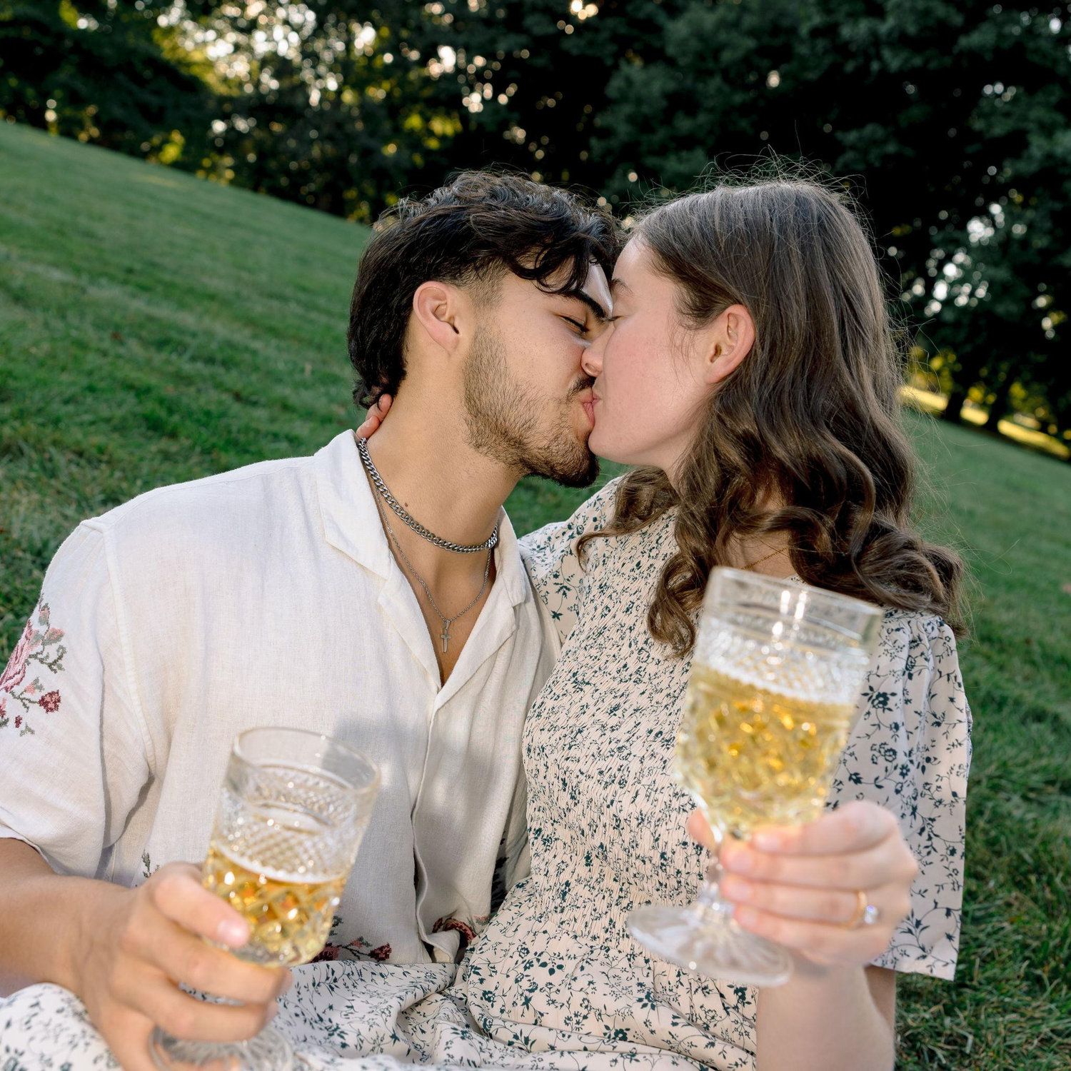 Sipping two glasses of sparkling grape juice!