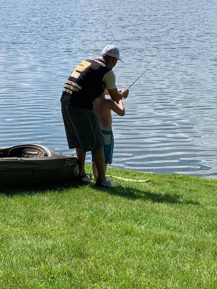 Shane teaching Cayleb how to cast while visiting Nana Brenda and Papa Mike.