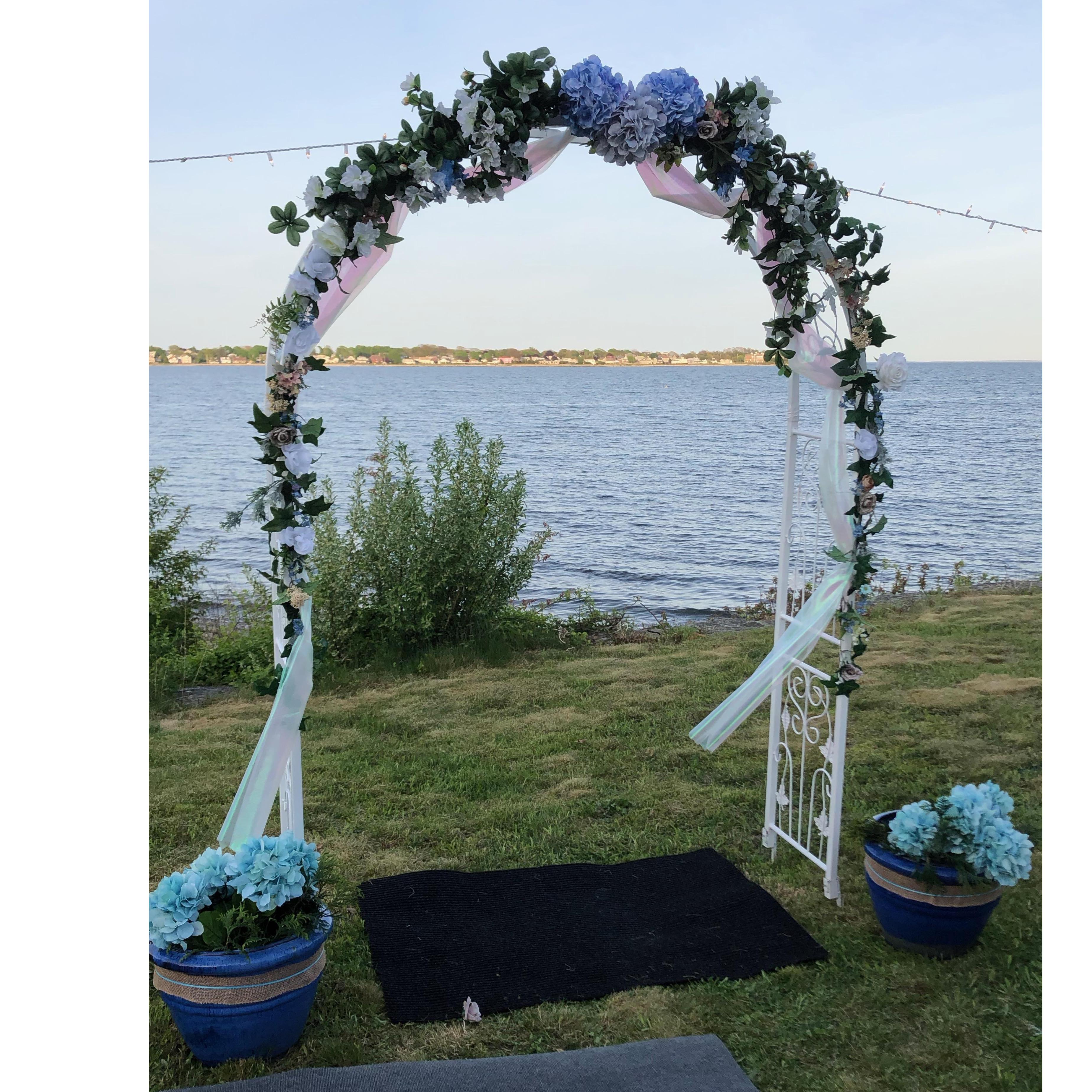 The arch, and many of the wedding decor items were graciously loaned from one of Nessie's friends.