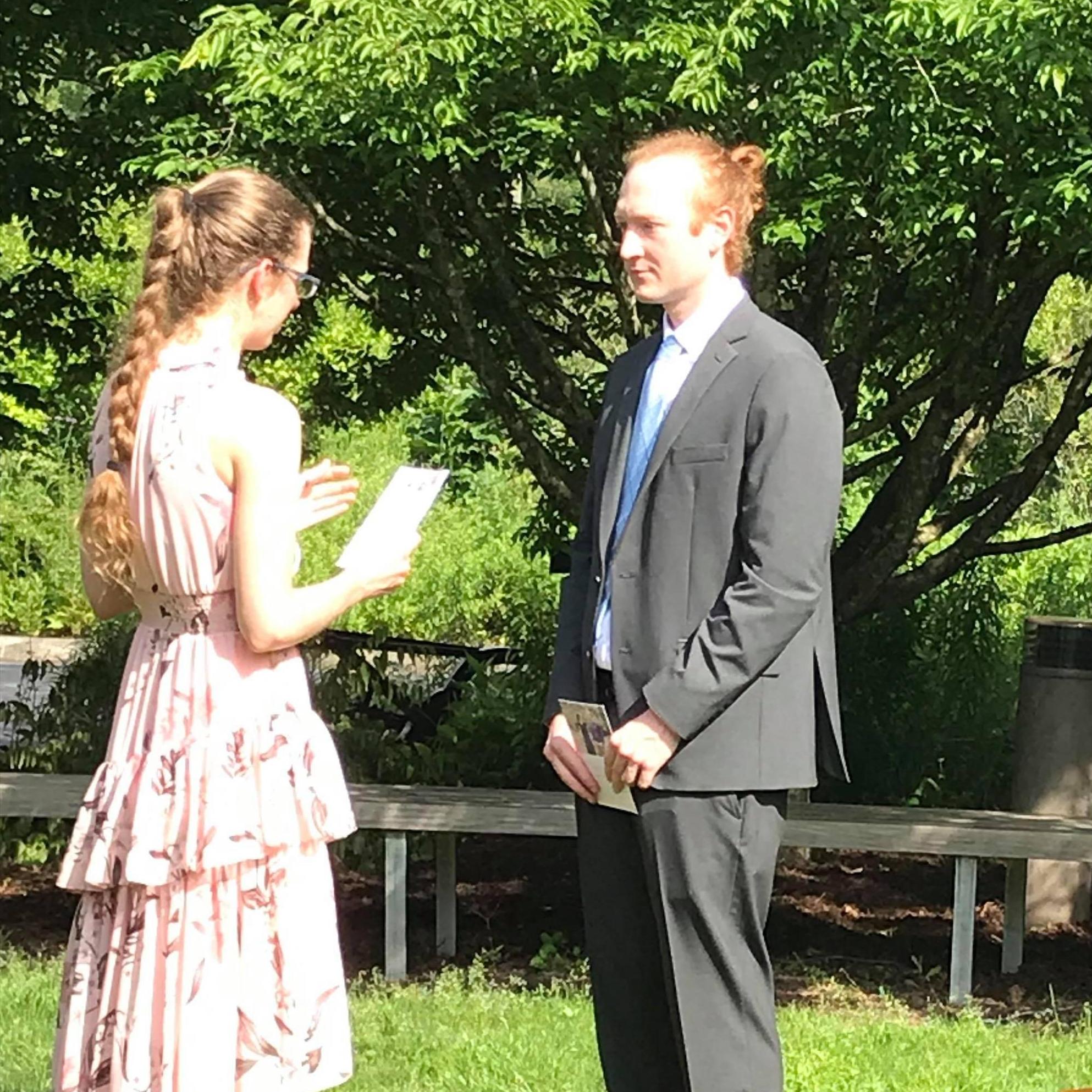 Laura reads her vows to her great-looking groom.