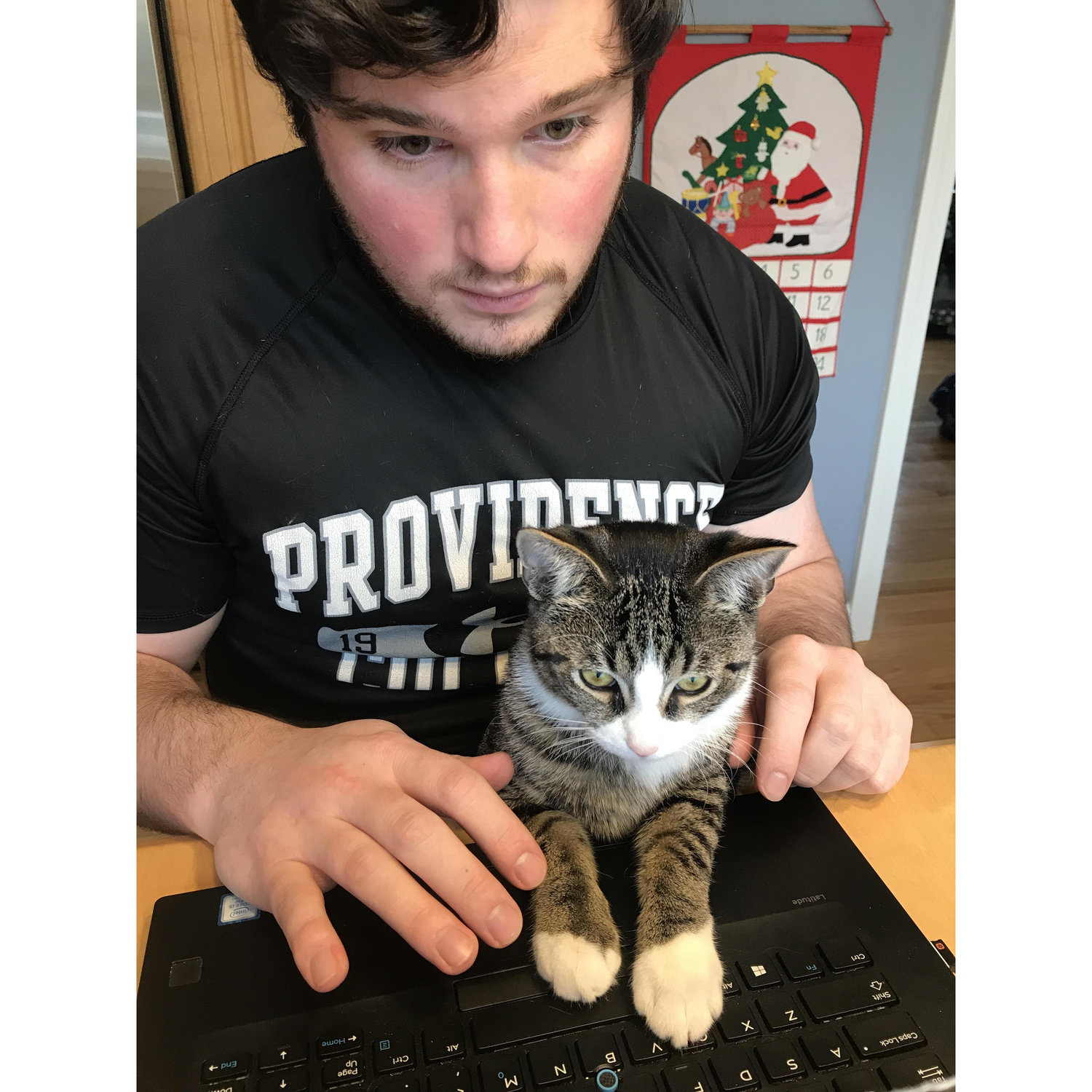 He loves to try to catch the mouse in the computer and to "help" Jon at work!