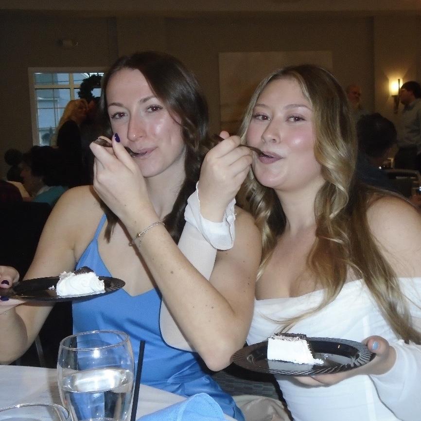 Bridesmaid Emily enjoying some cake