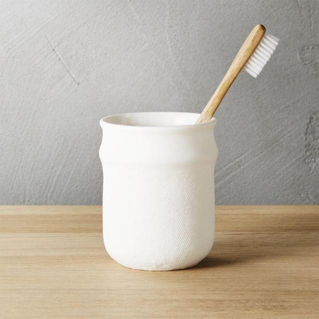 Canvas toothbrush-razor cup