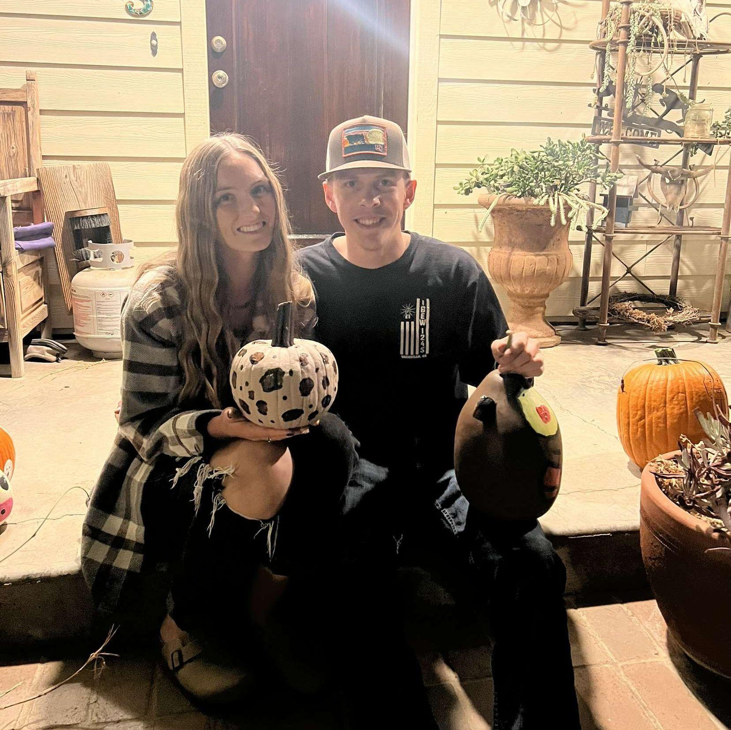 A picture of us after painting pumpkins with friends. October 2023