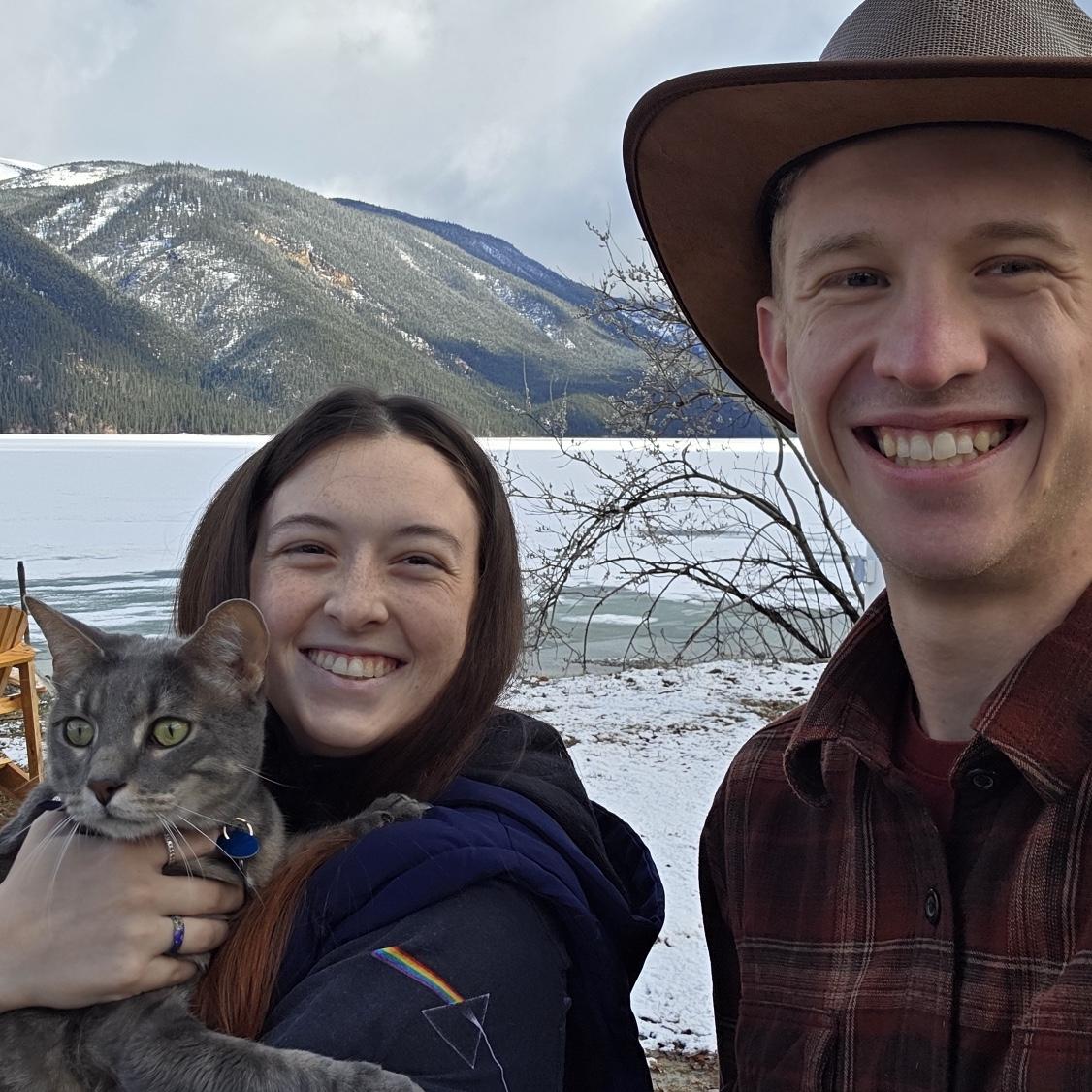 Here we are, at a frozen lake with our Cody! This was halfway through our drive from Colorado to Alaska!