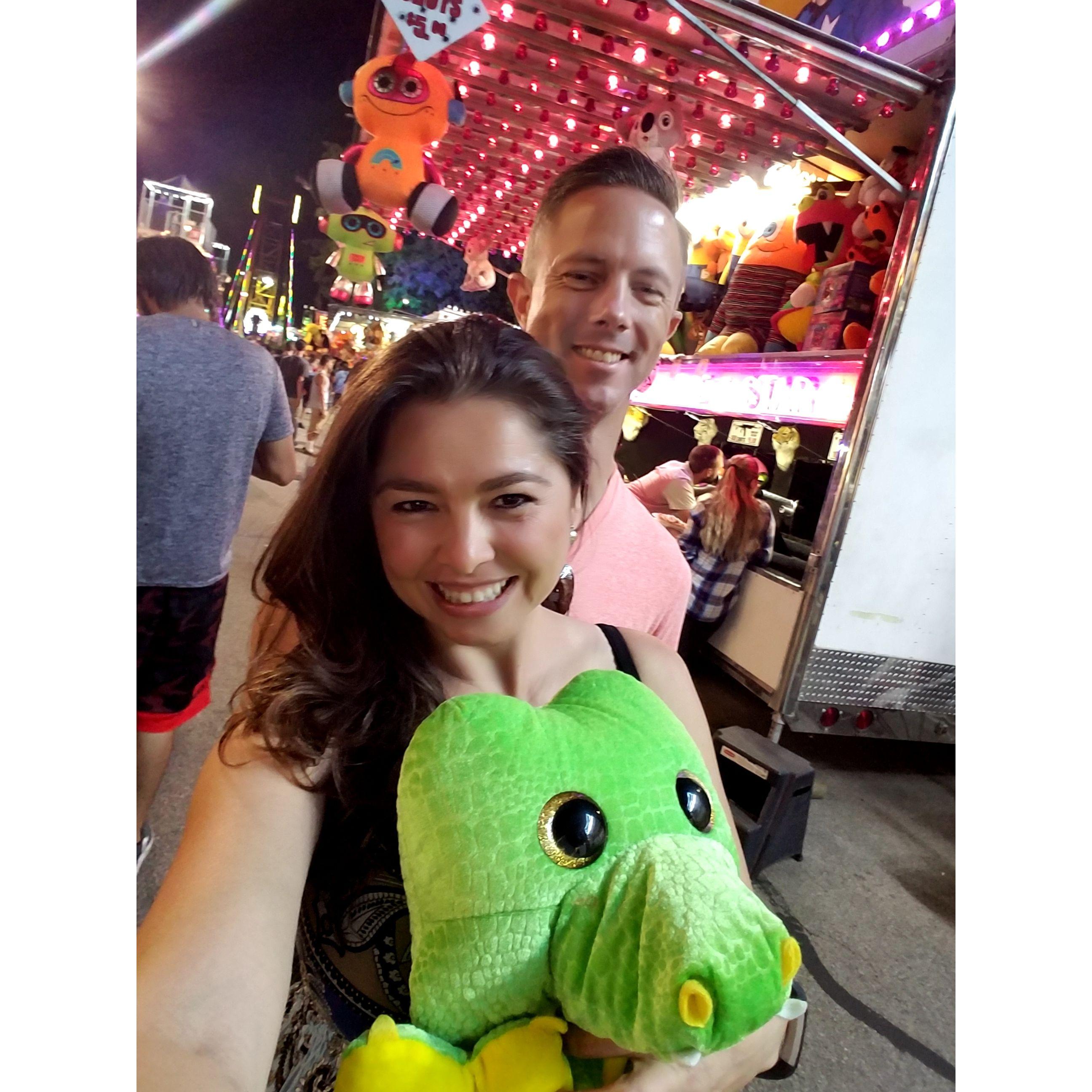 Our third date at the Naperville Final Fling. Will showed off his football skills by winning a stuffed gator for me, that now sits in my office.