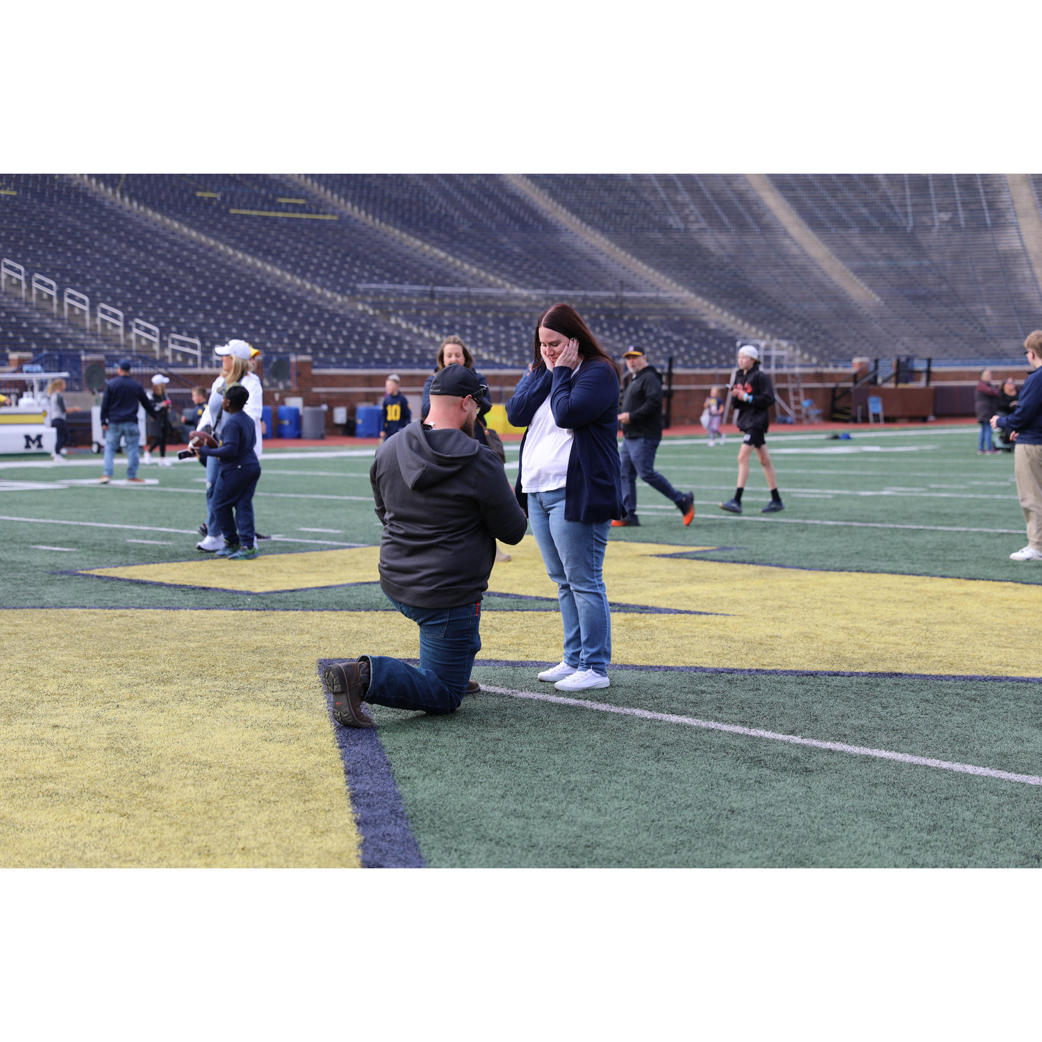 When Brad popped the question at The Big House in Ann Arbor!