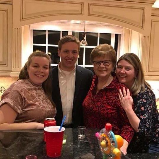 Carol, Jason, Grammy, & Mom celebrating Christmas together