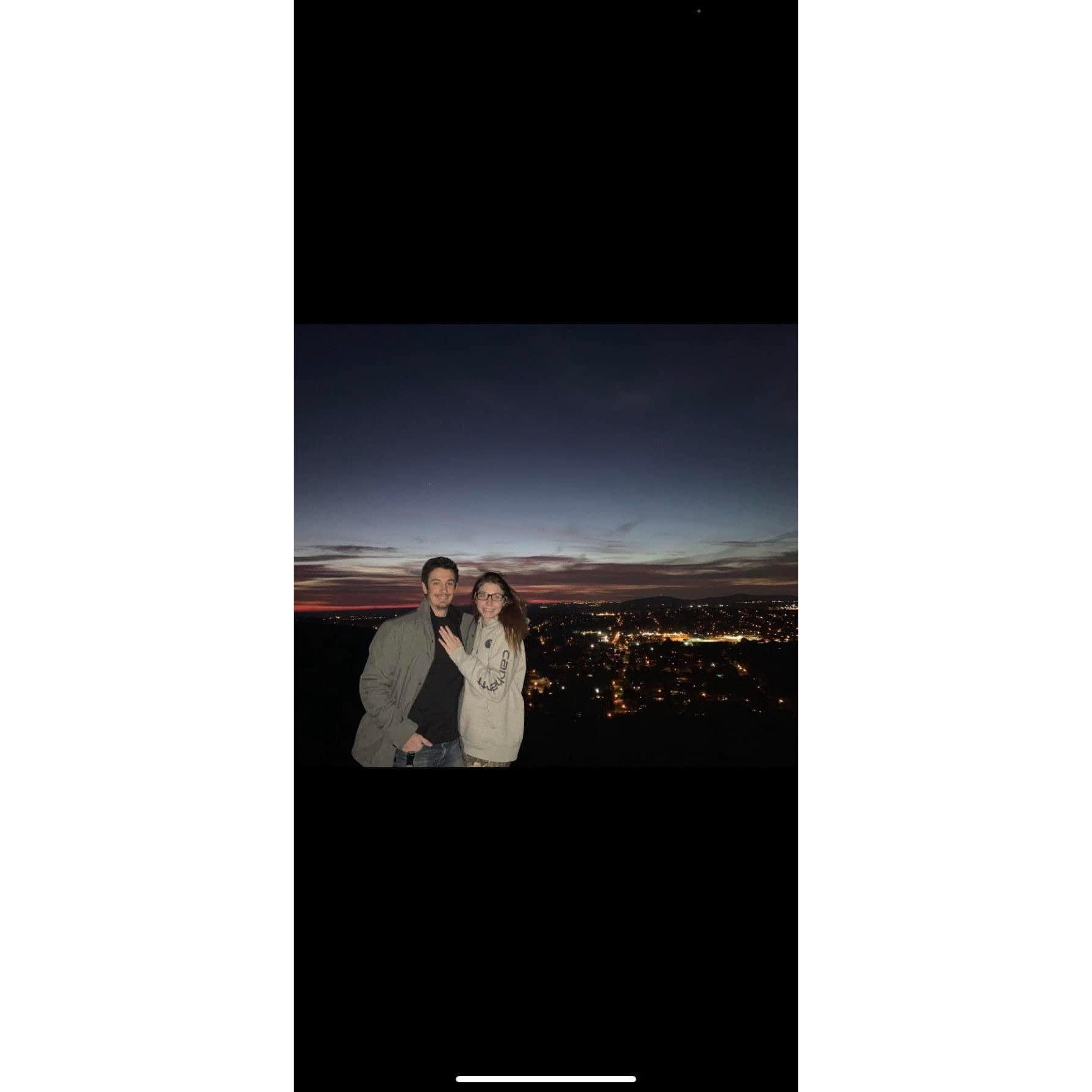 This picture was taken at the first place we hiked together. The lights behind us are Huntsville AL.