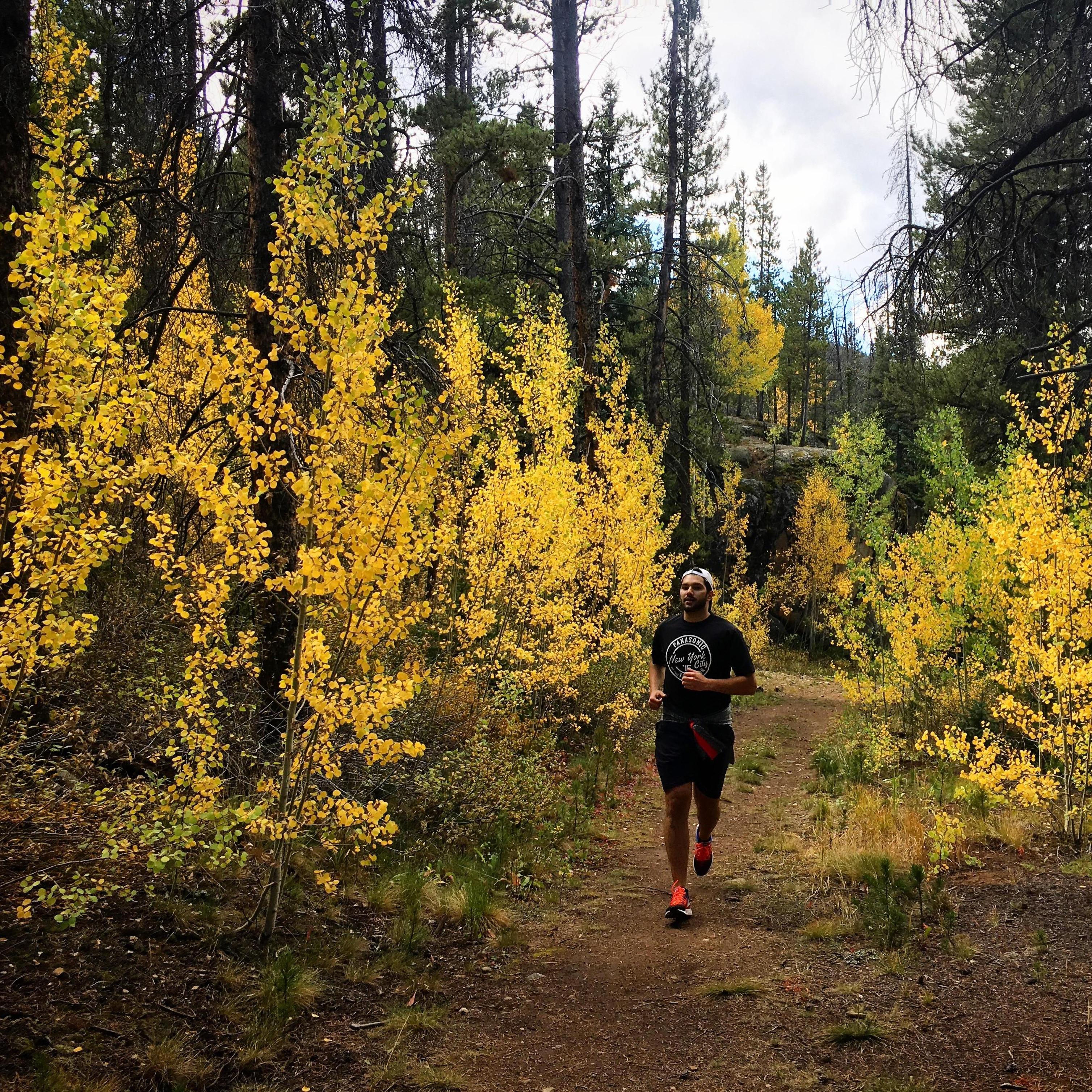 Trail run with autumn leaves in Keystone