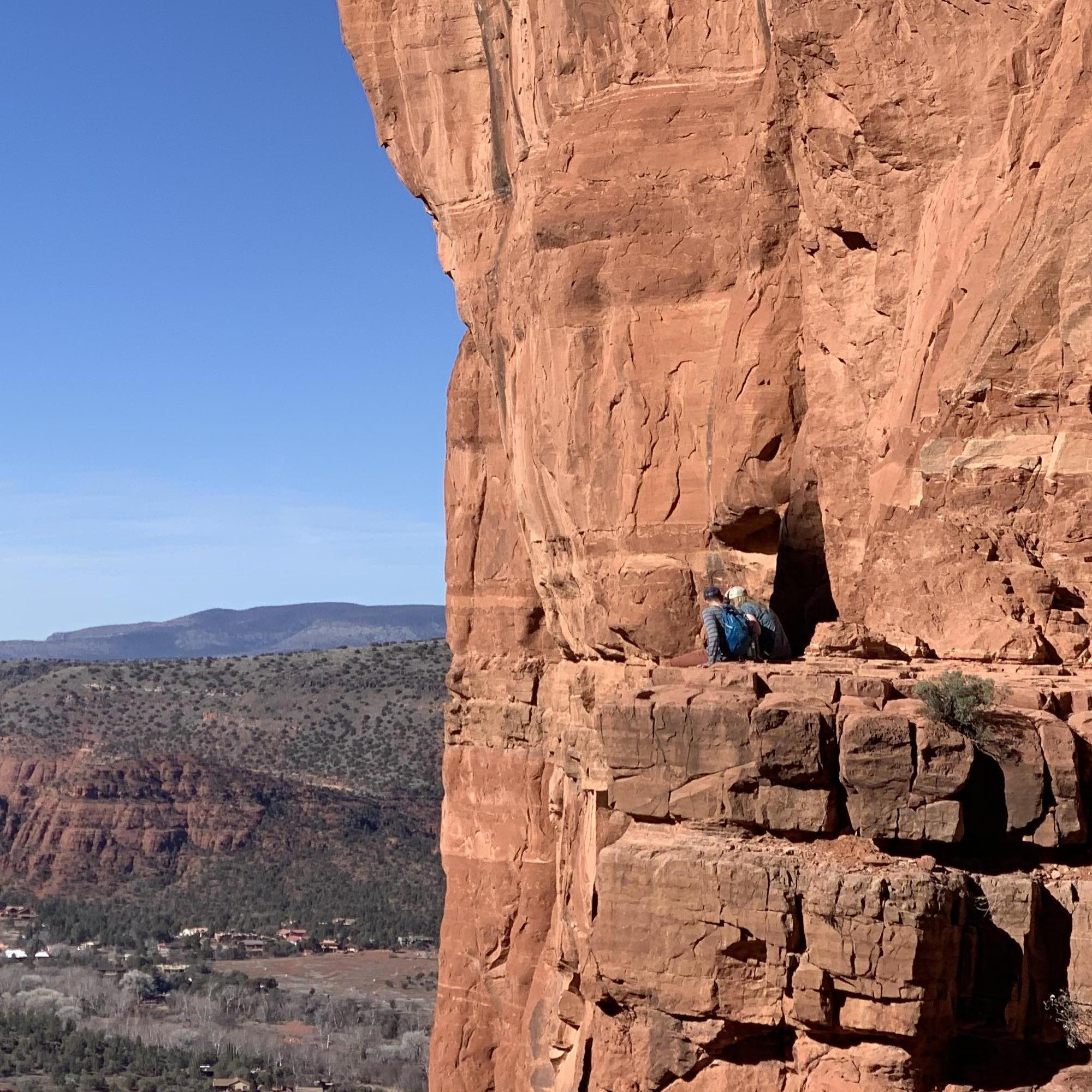 Our friend snapped this pic of us chatting on a ledge before we were even dating, on a trip to Sedona for a hike at Cathedral Rock