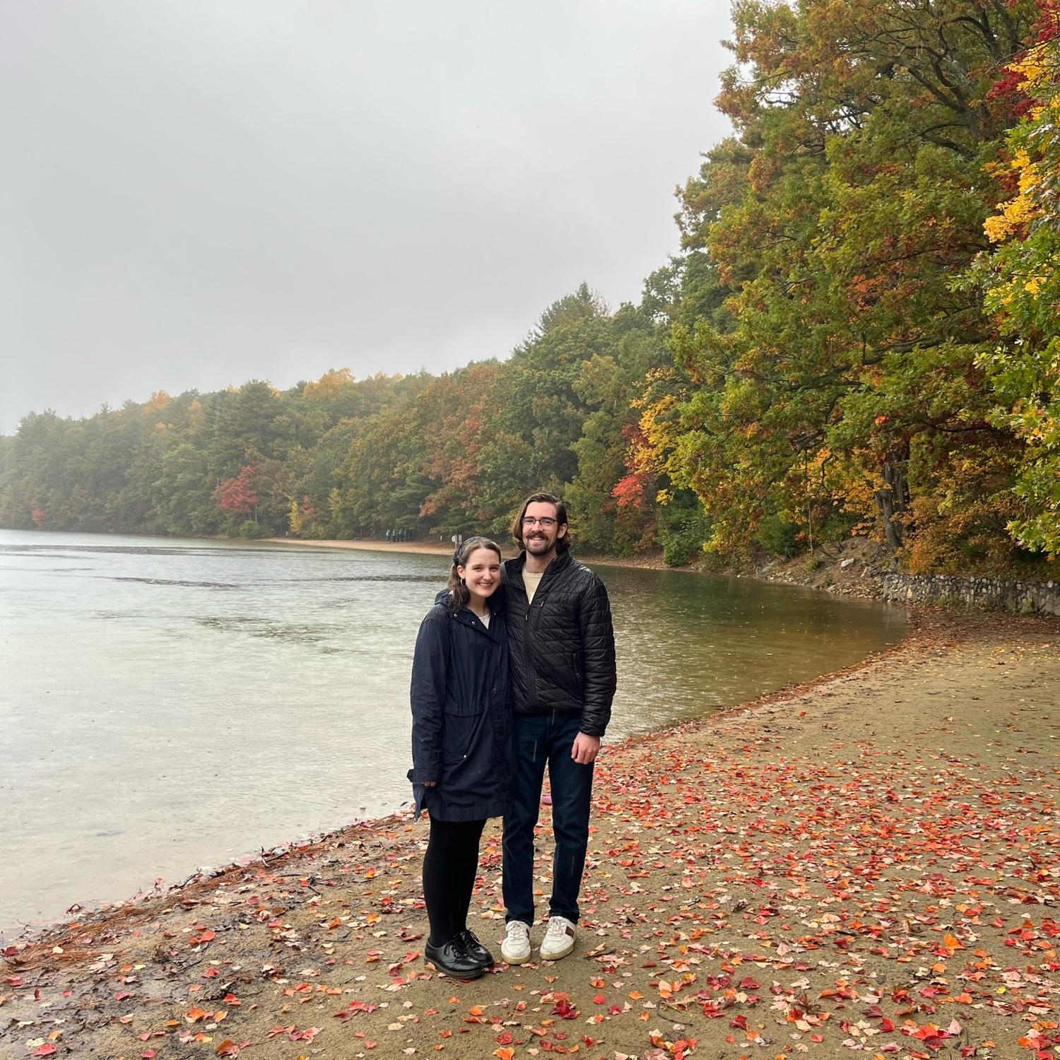 Us at Walden Pond in October 2023. Little did we know in a year and a half we’d get engaged in the same spot! (and Genevieve would be wearing the same rain coat!)
