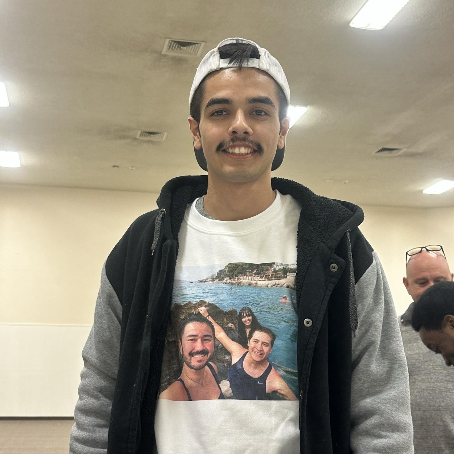 Javier wearing a picture of us (and Ariel) on a sweatshirt