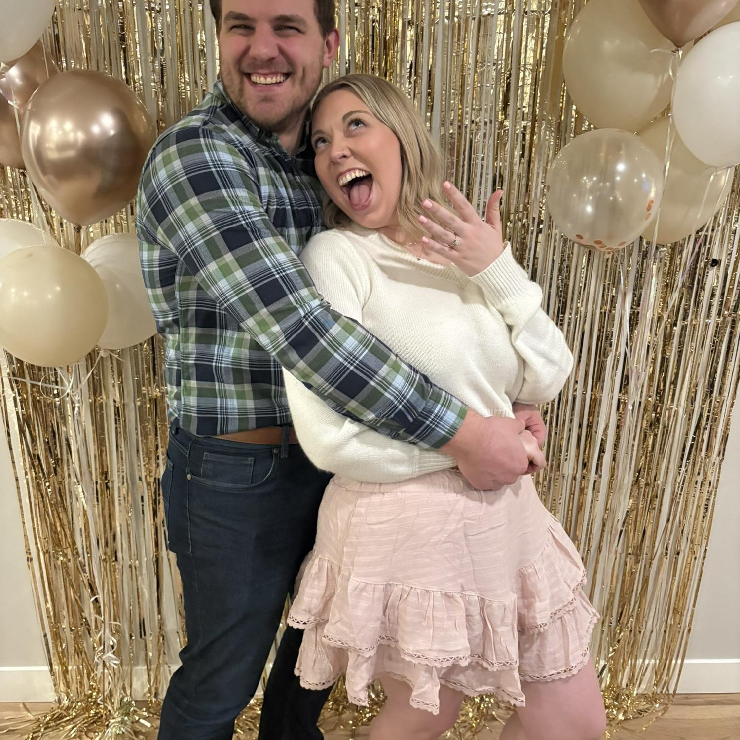 Celebrating our engagement with sweet friends and family in Madison! 🥂
