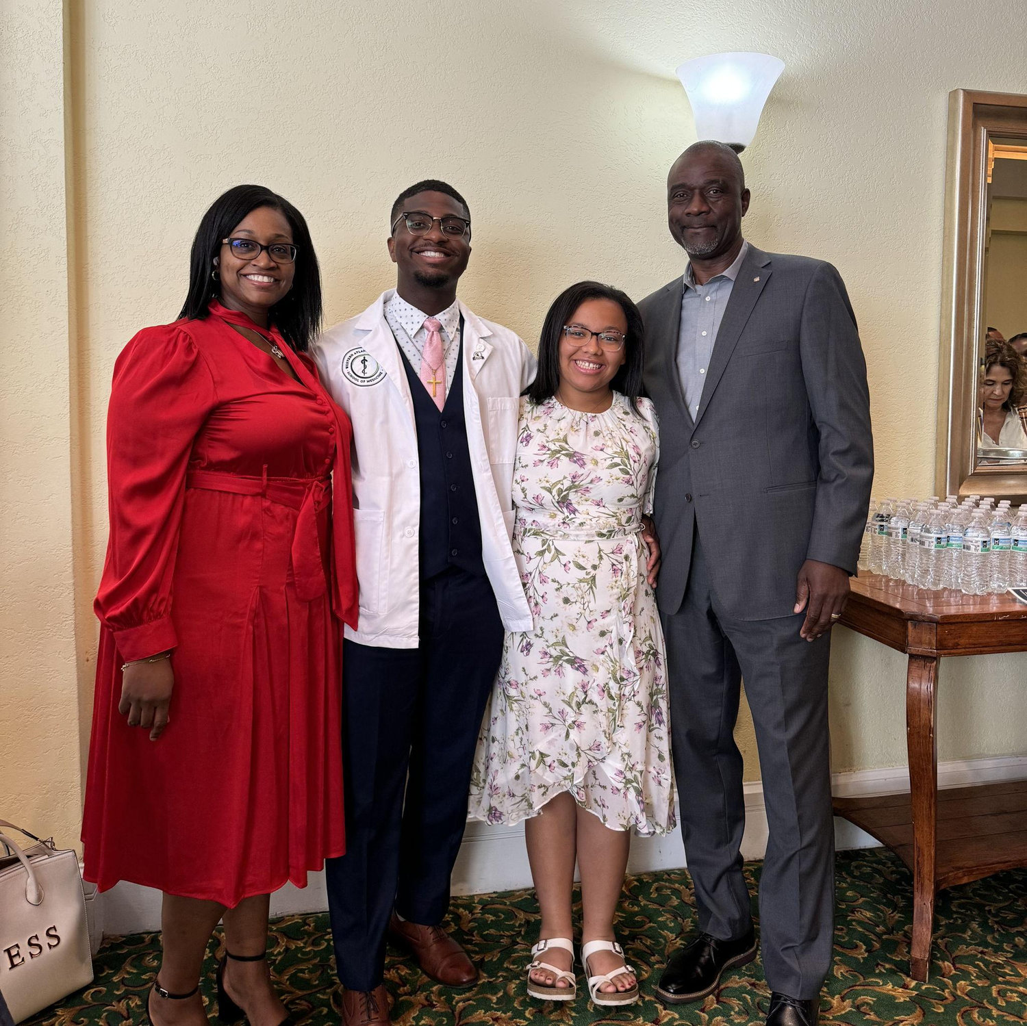 Khalil's White Coat Ceremony, 2024. Surprised the building didn't burn down with these four hot people.