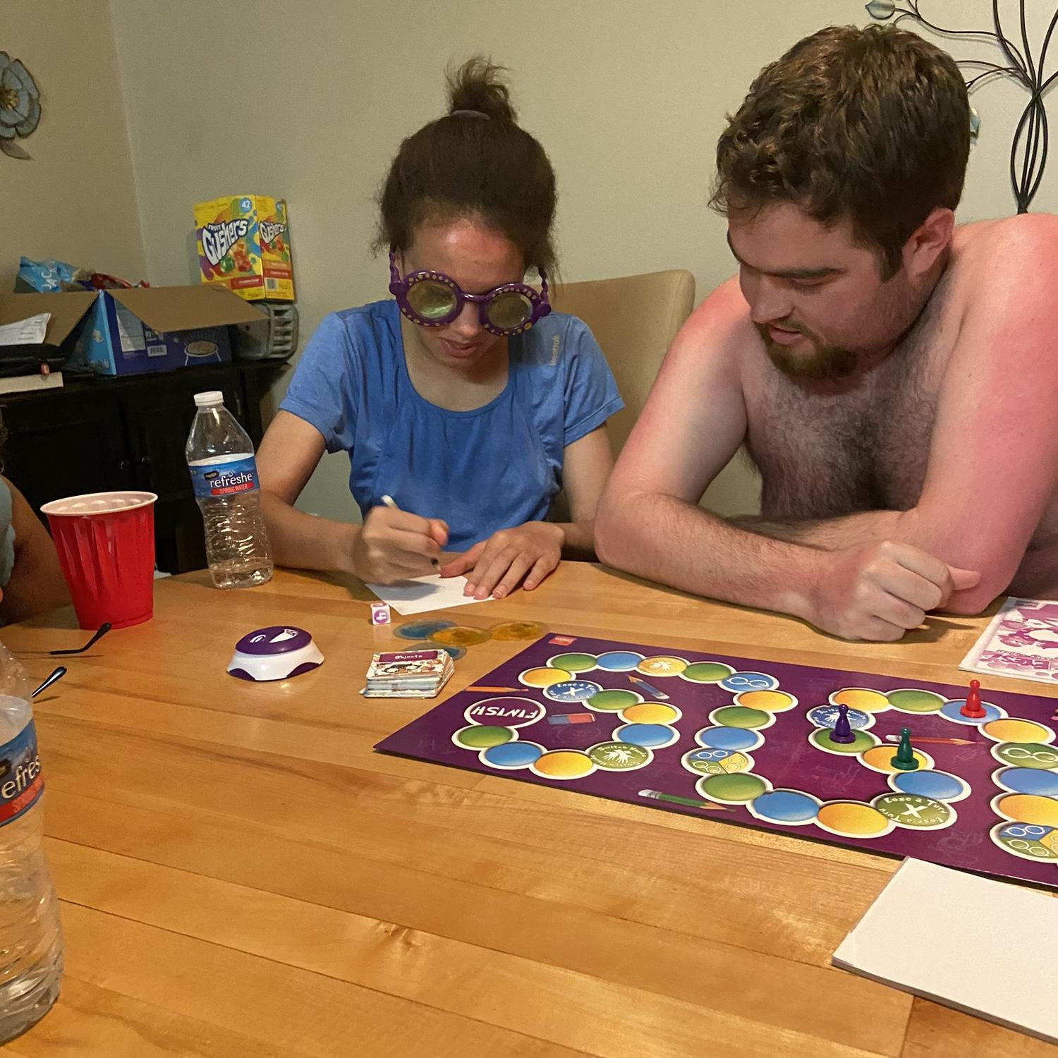 Laura and Ben concentrating while playing “Beer Goggles”.