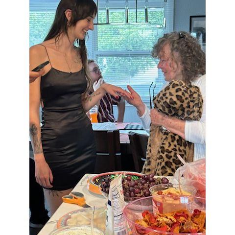 showing off the engagement ring to Grandma Cheryl at our engagement party at the family farm in Madrid, IA 9/9/2023