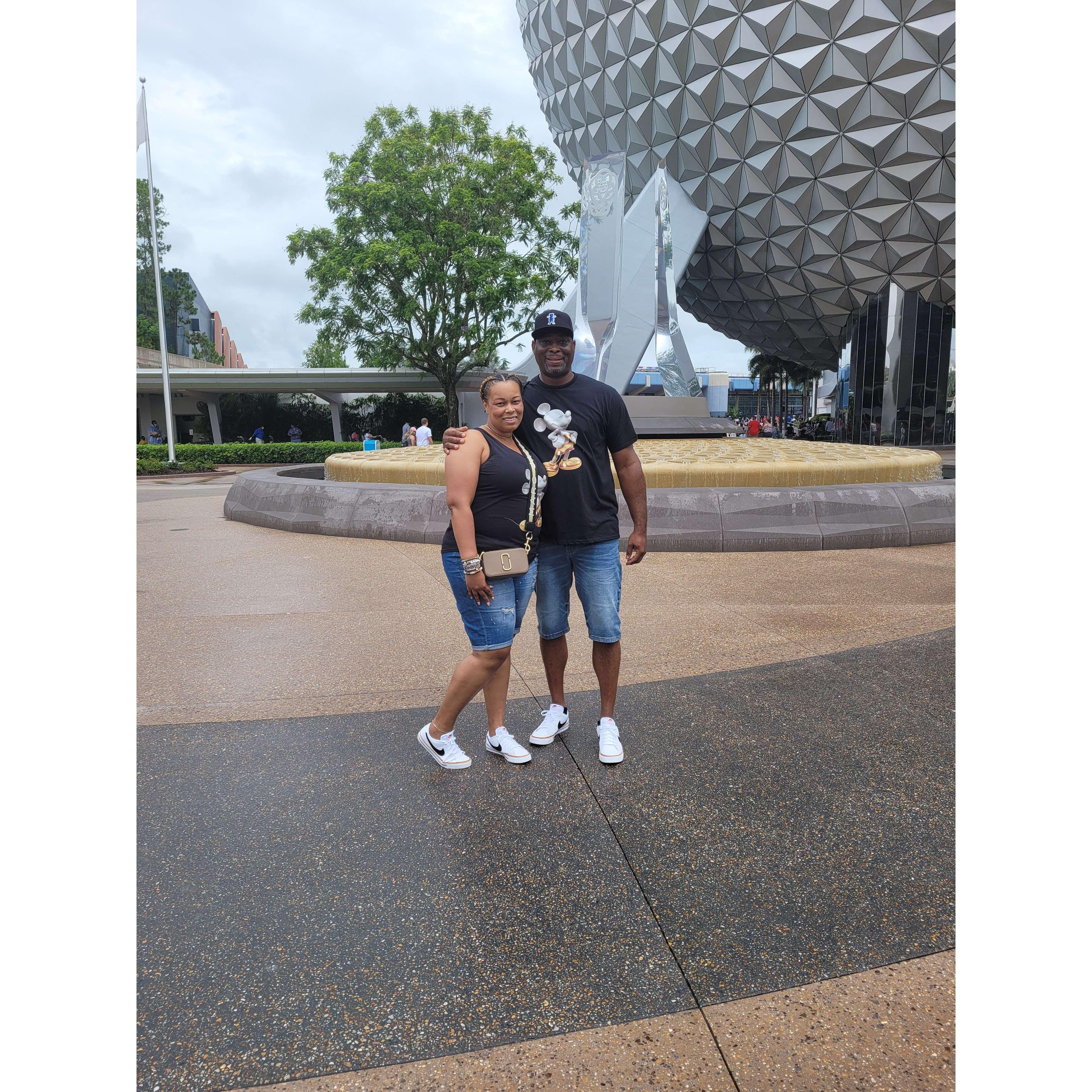 At Epcot in our matching Mickey shirts. (July, 2021)