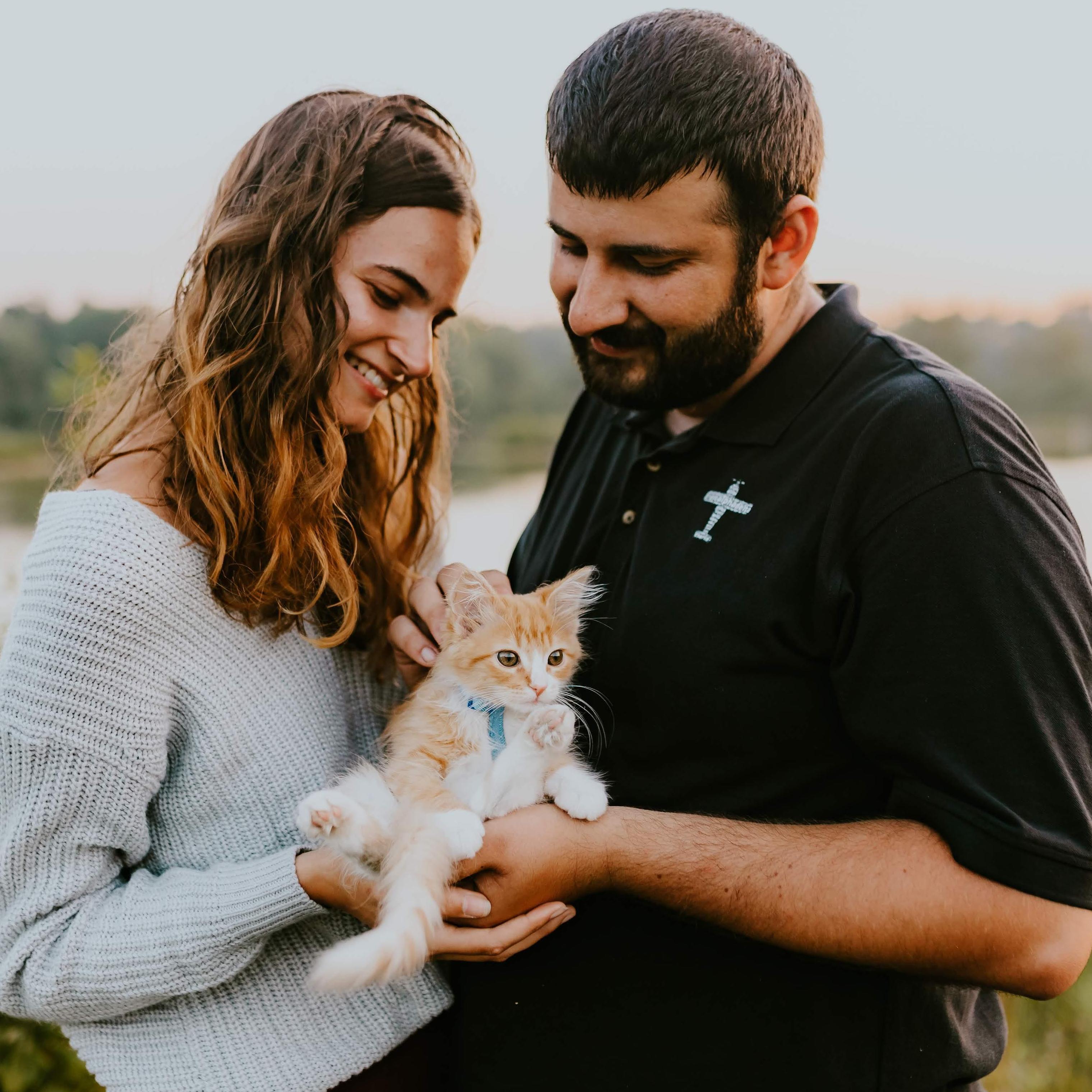 One of our first family photos. Our kitten found us, waiting outside our apartment door one morning.