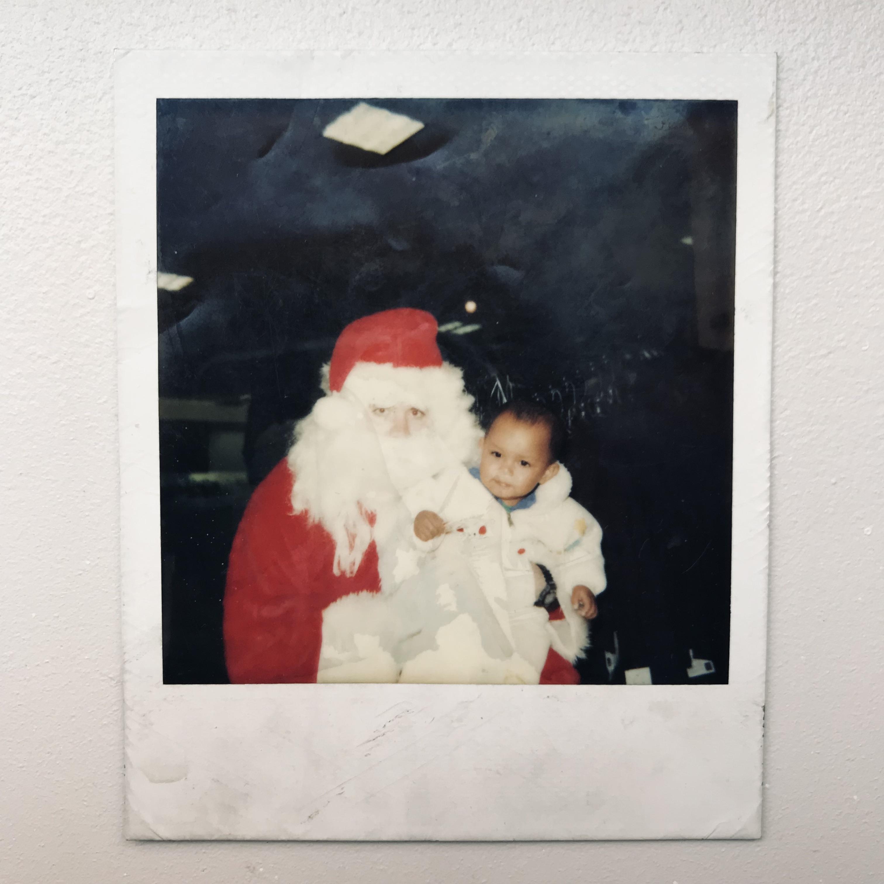 Kathy at 14 months hanging with Santa Claus.