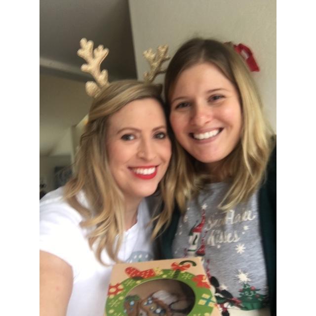 Raissa and Ana decoring Christmas cookies.