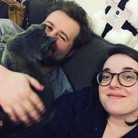 The best picture we have with the three of us: Erica, Carleton, and our very snuggly cat, Cordelia.
