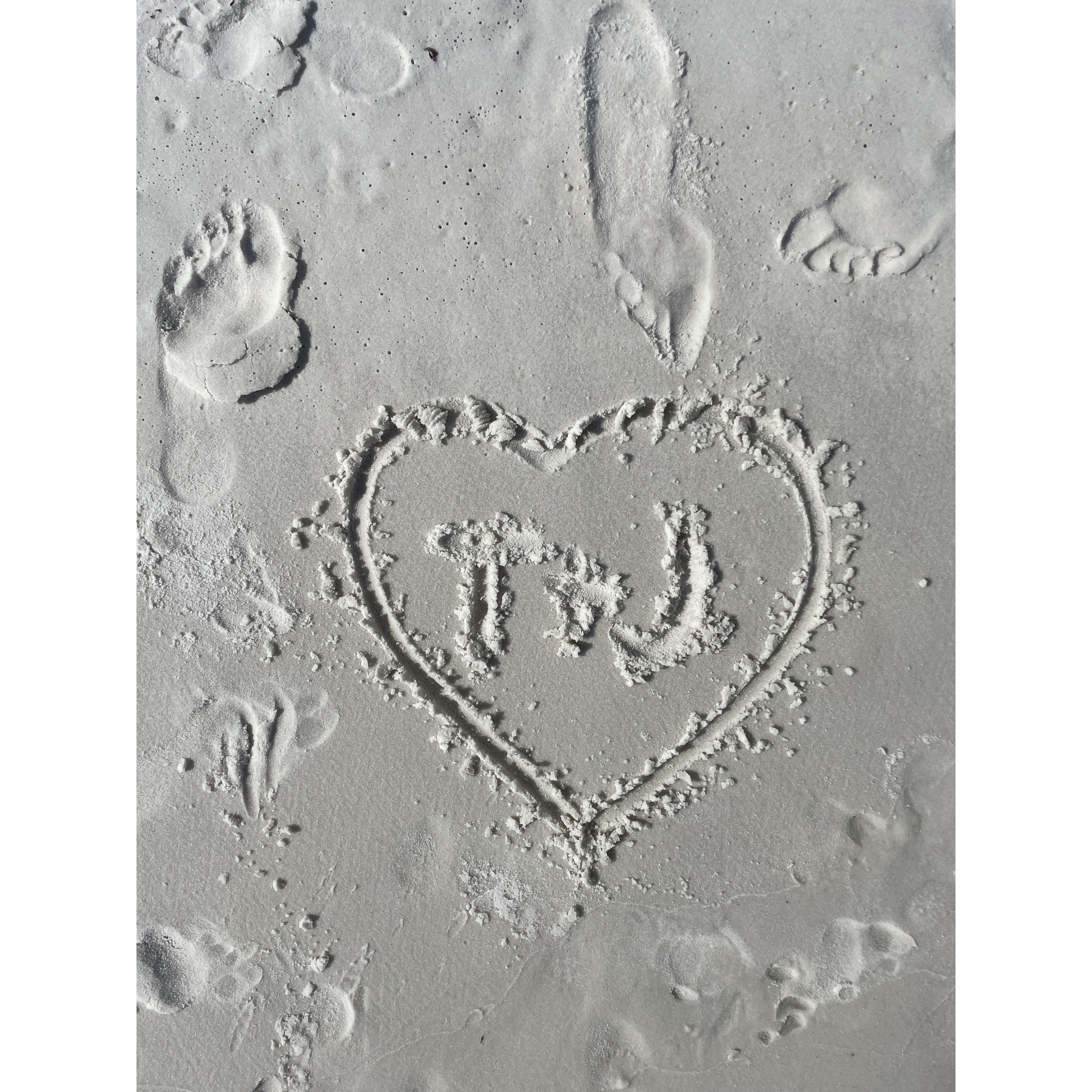 our initials in the sand