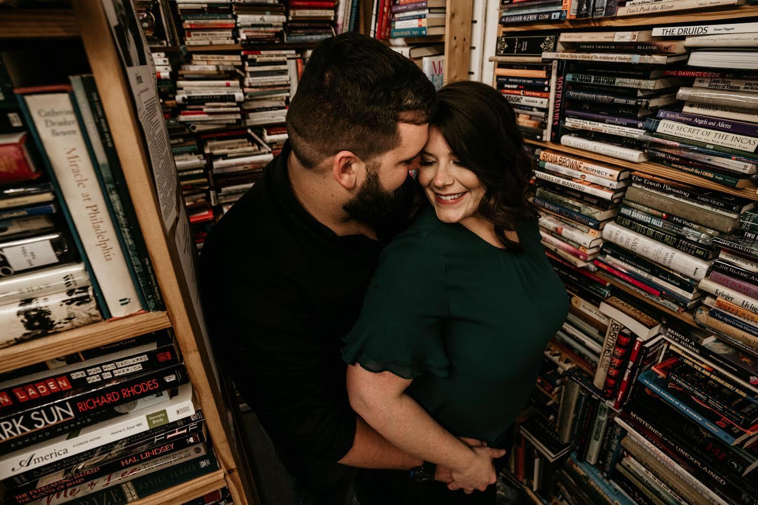 Stealing a quick hug and kiss in this little bookstore corner